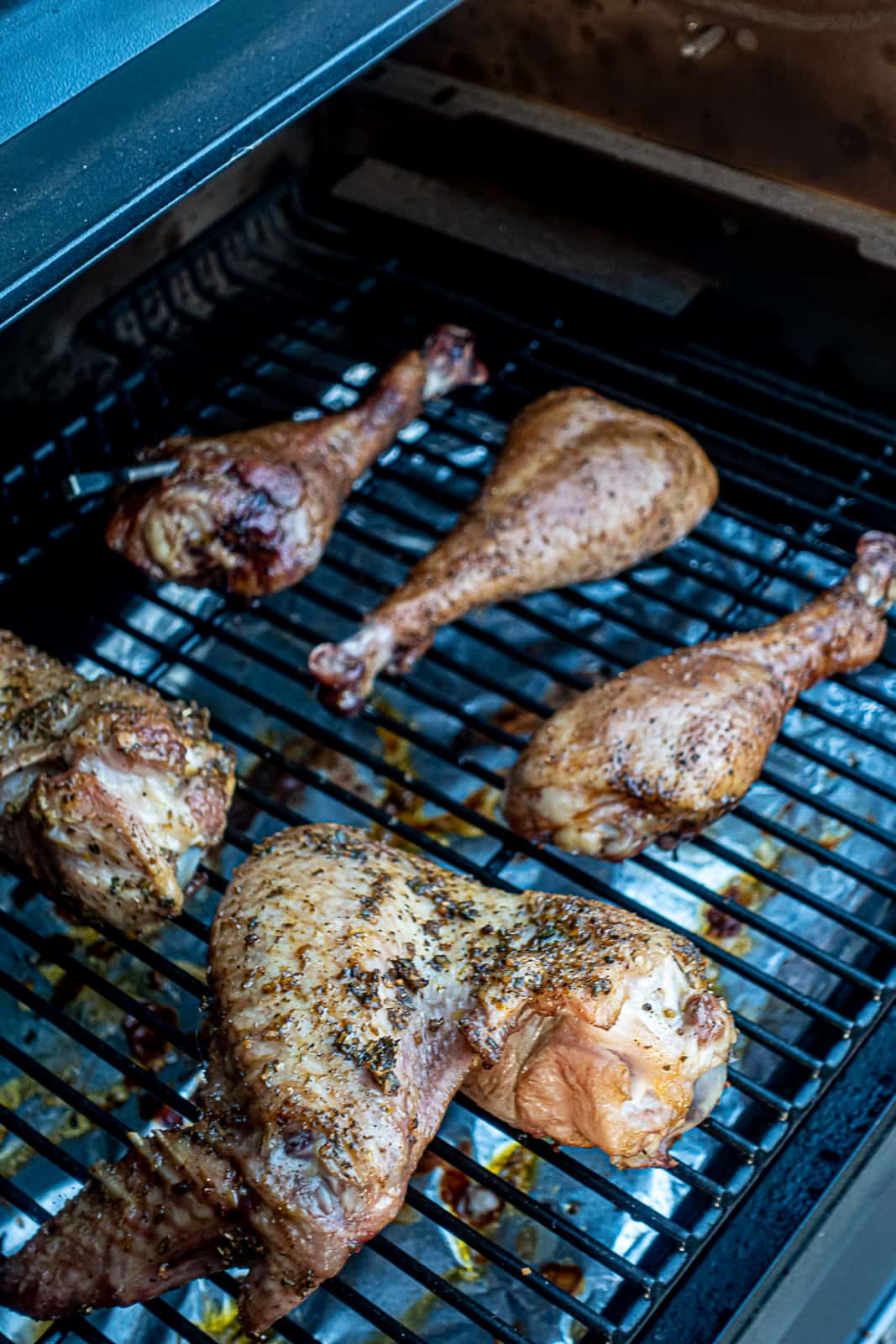 Smoking turkey legs and wings on the Traeger pellet grill Sip Bite Go