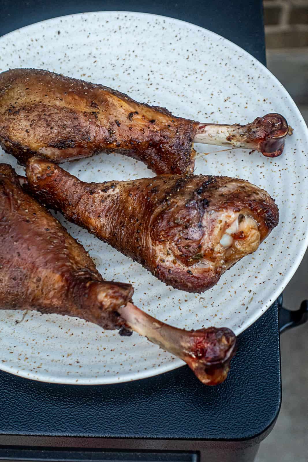 https://sipbitego.com/wp-content/uploads/2022/11/Traeger-smoked-turkey-legs-thanksgiving-side-dish-Sip-Bite-Go.jpg