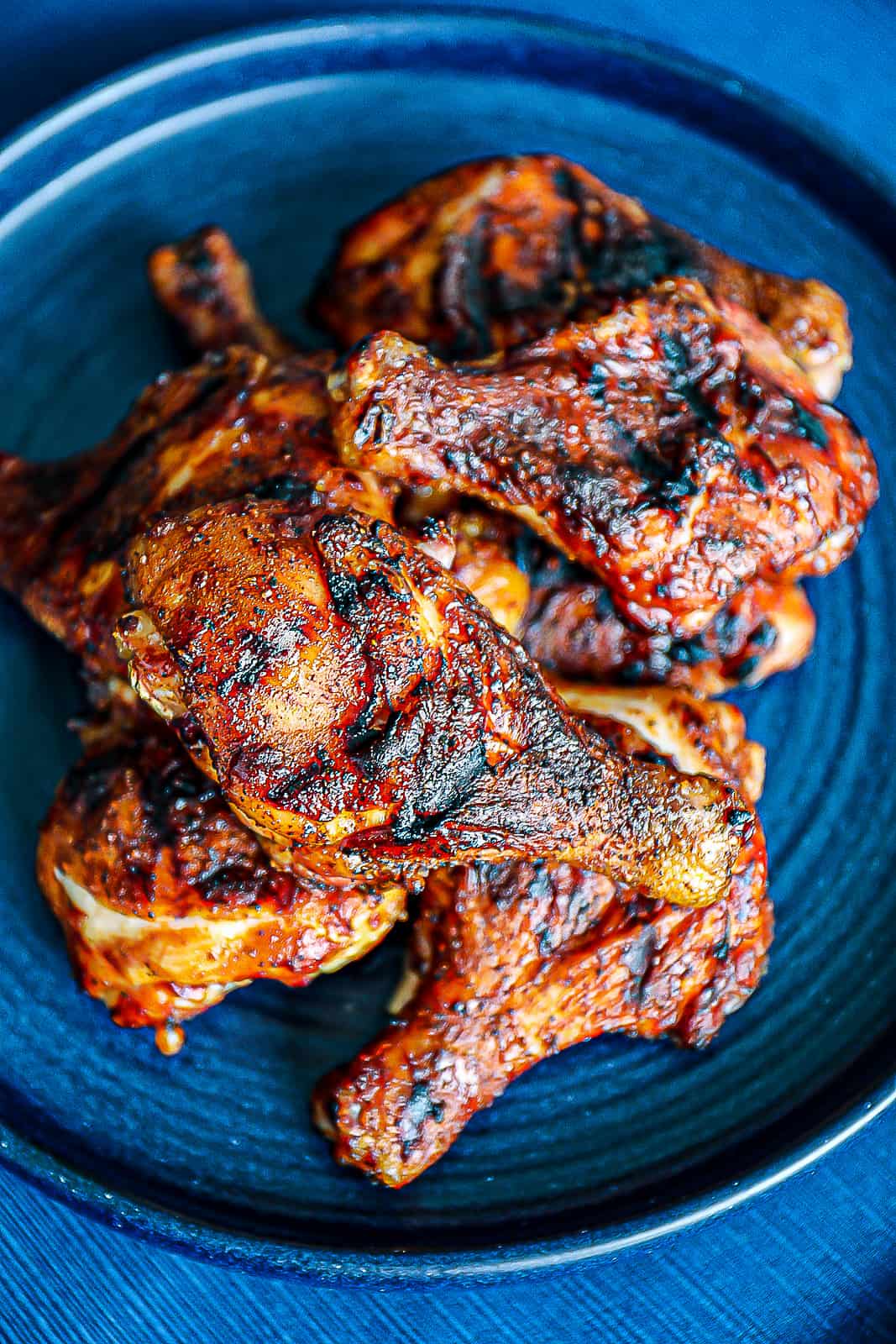 BBQ chicken legs on a dinner plate