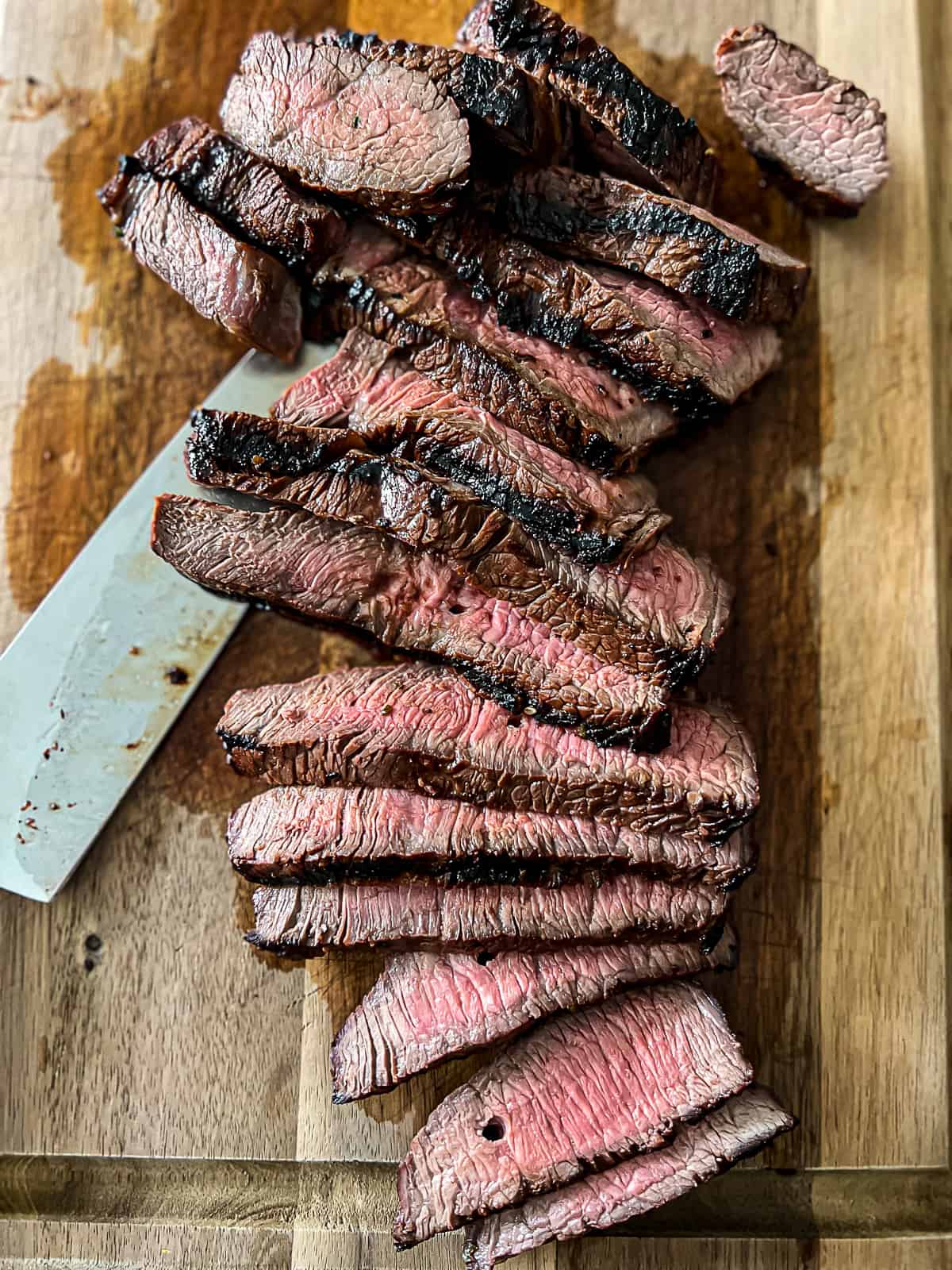 Sliced Grilled Sirloin Steak on cutting board