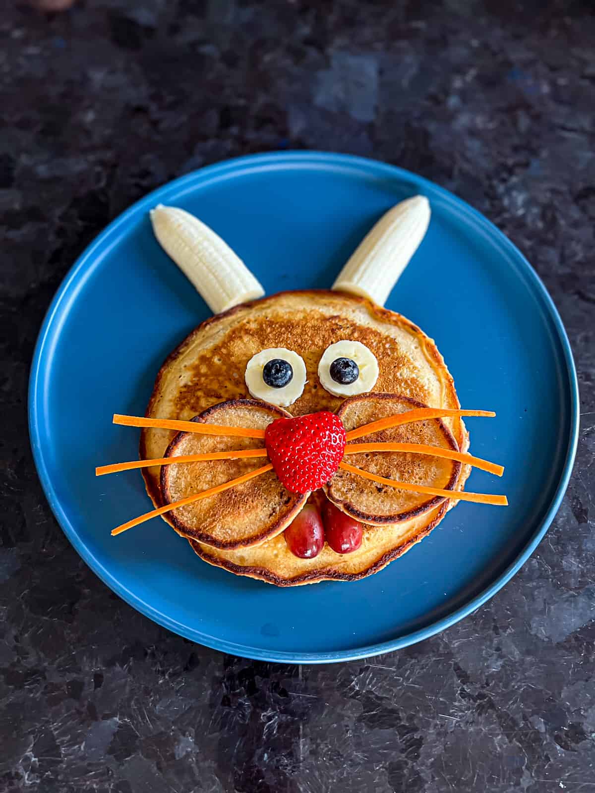 Cute Easter Bunny Face Pancake with fruit and carrots