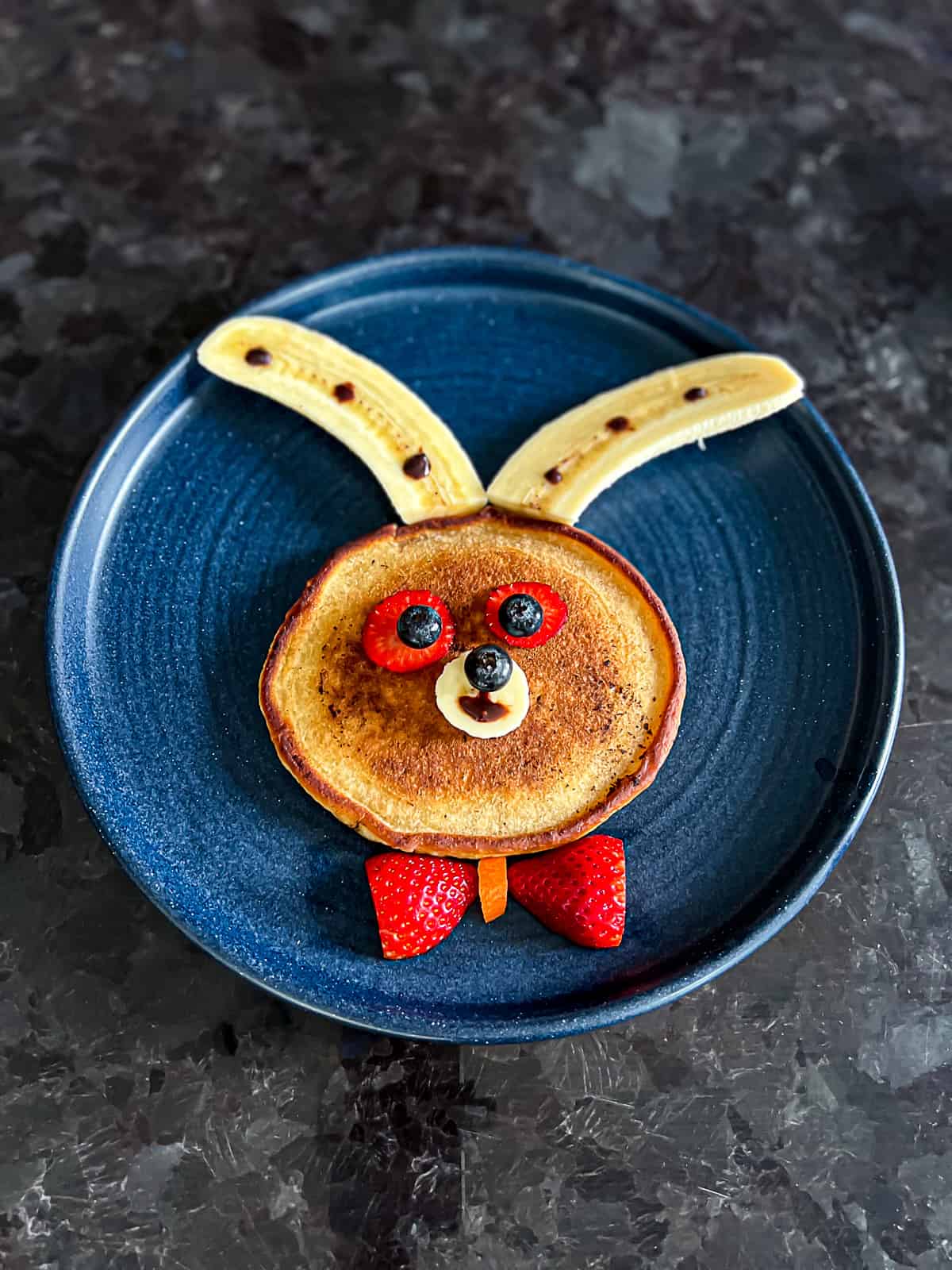 Easter Bunny Pancake Idea with Banana Ears and Strawberry Bowtie