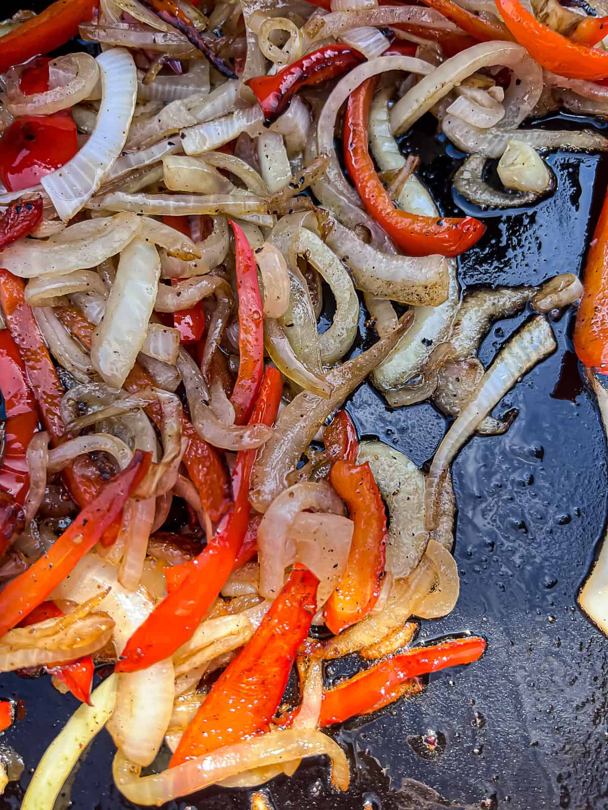 Griddled onions and peppers on Flatrock Grill from Traeger
