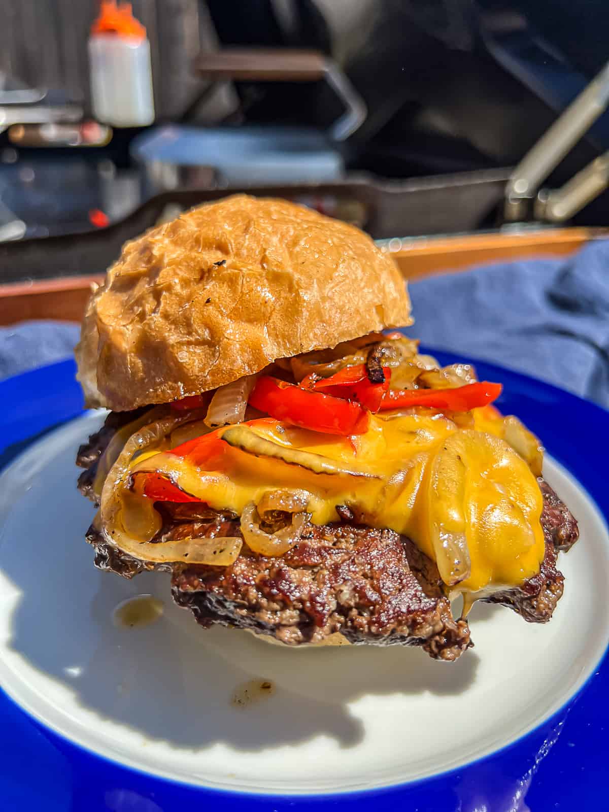 Philly cheesesteak style smashed burgers