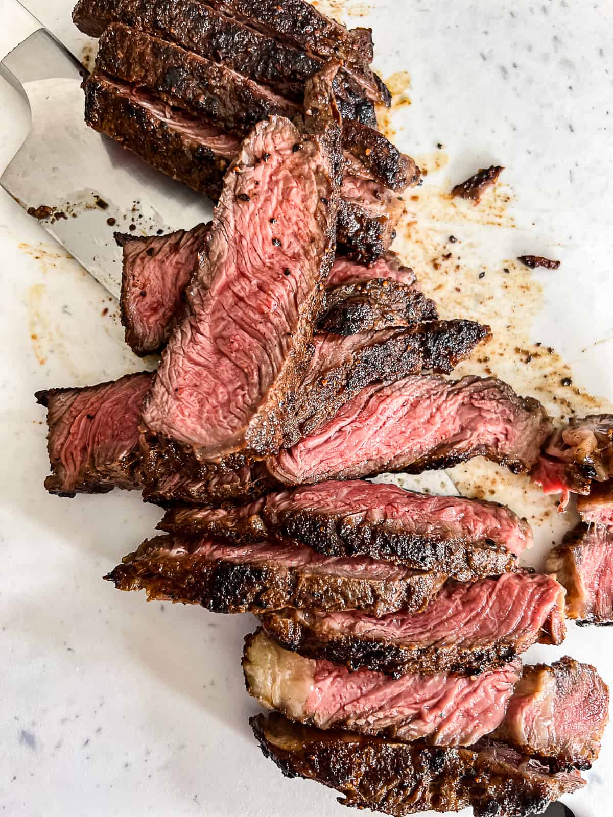 Closeup of Griddled Ribeye Steak Medium Rare Sliced 