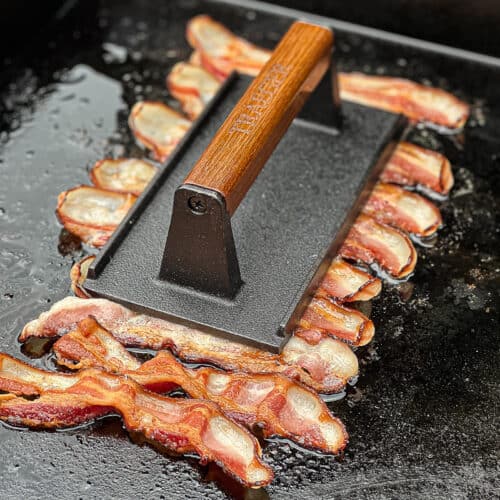 https://sipbitego.com/wp-content/uploads/2023/04/Cooking-Bacon-on-Griddle-with-Traeger-Grills-press-using-the-Flatrock-Grill-Sip-Bite-Go-500x500.jpg