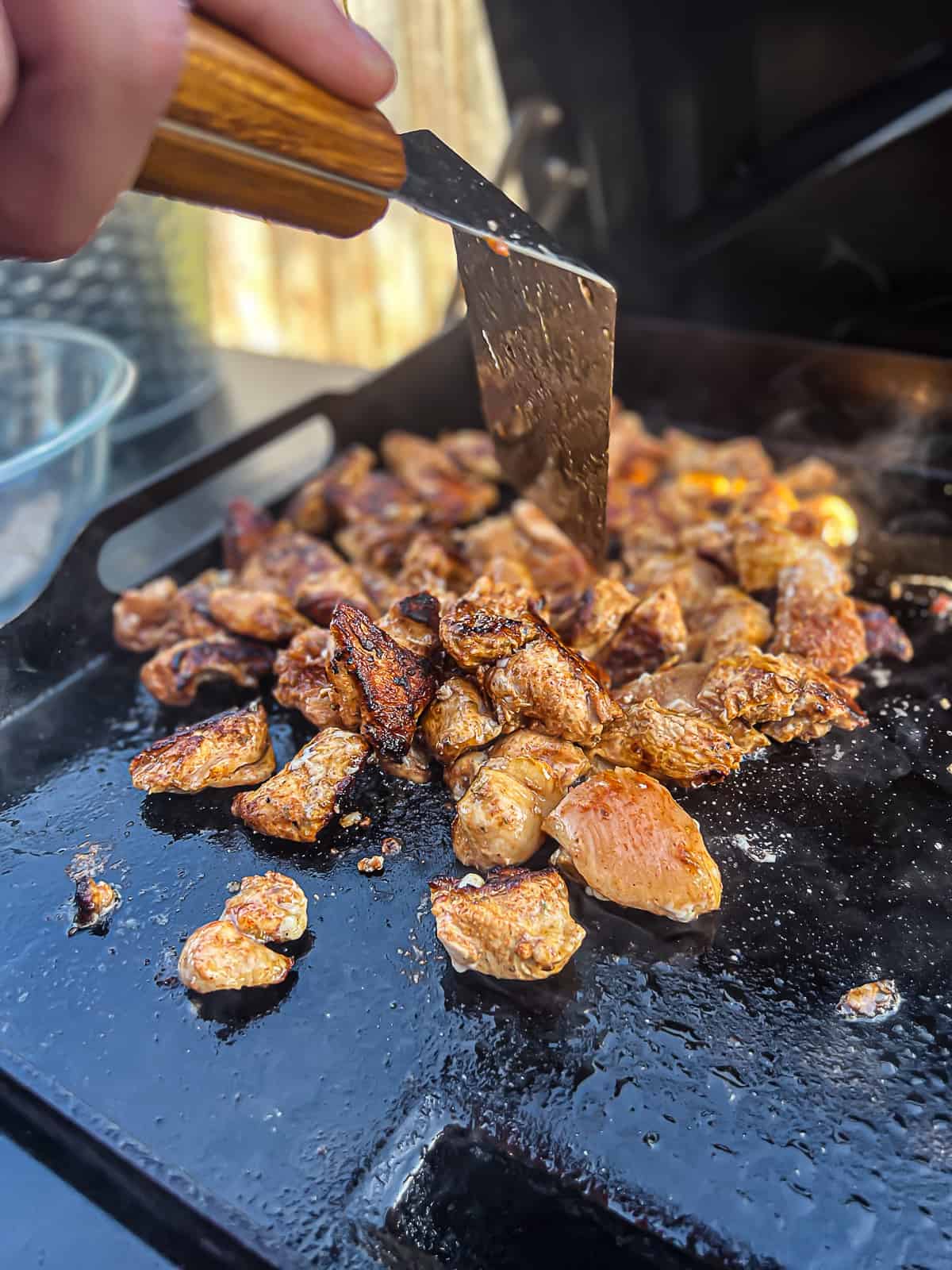 Cooking chicken fajita meat on Traeger Flatrock Griddle Grill 