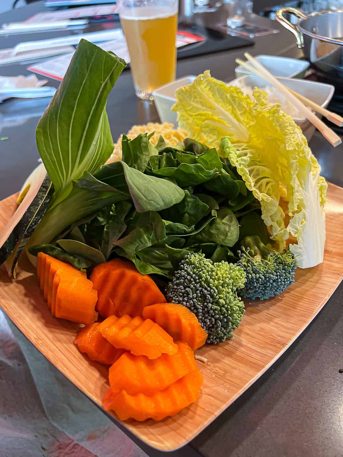 Cooking vegetables in Hot Pot Broth at Tabu Shabu in McKinney Texas