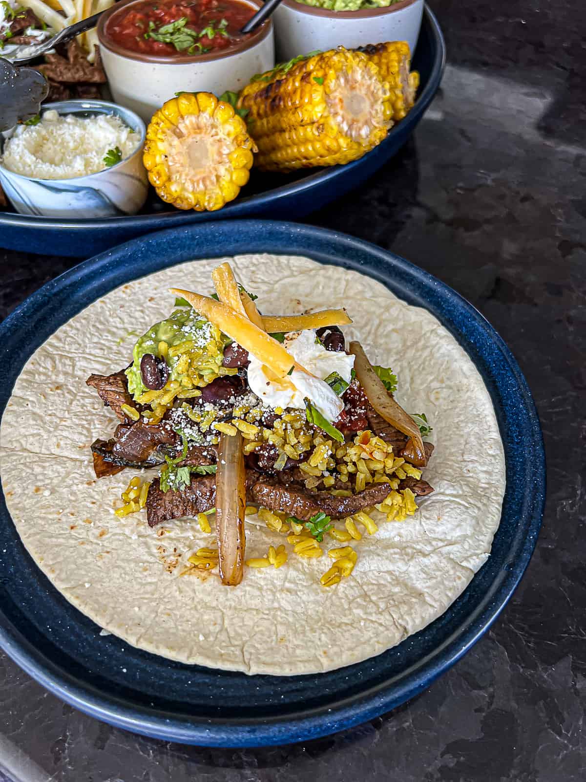 Steak Fajita Taco with Toppings including rice and cheese and grilled onions Side Dish Ideas 
