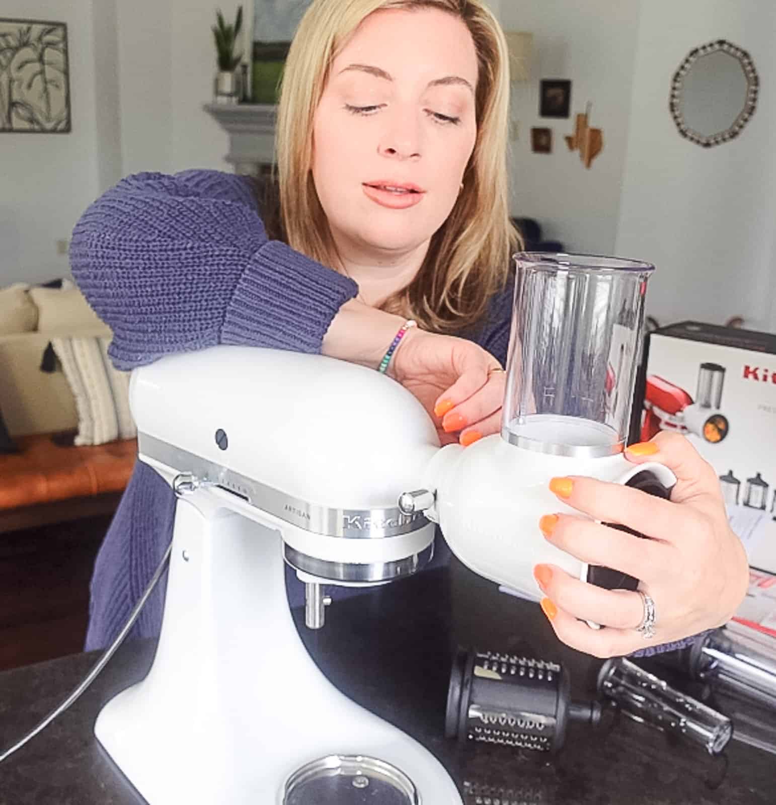 https://sipbitego.com/wp-content/uploads/2023/04/Woman-Attaching-the-KitchenAid-Fresh-Prep-Slicer-Shredder-with-Jenna-Passaro-from-Sip-Bite-Go.jpg