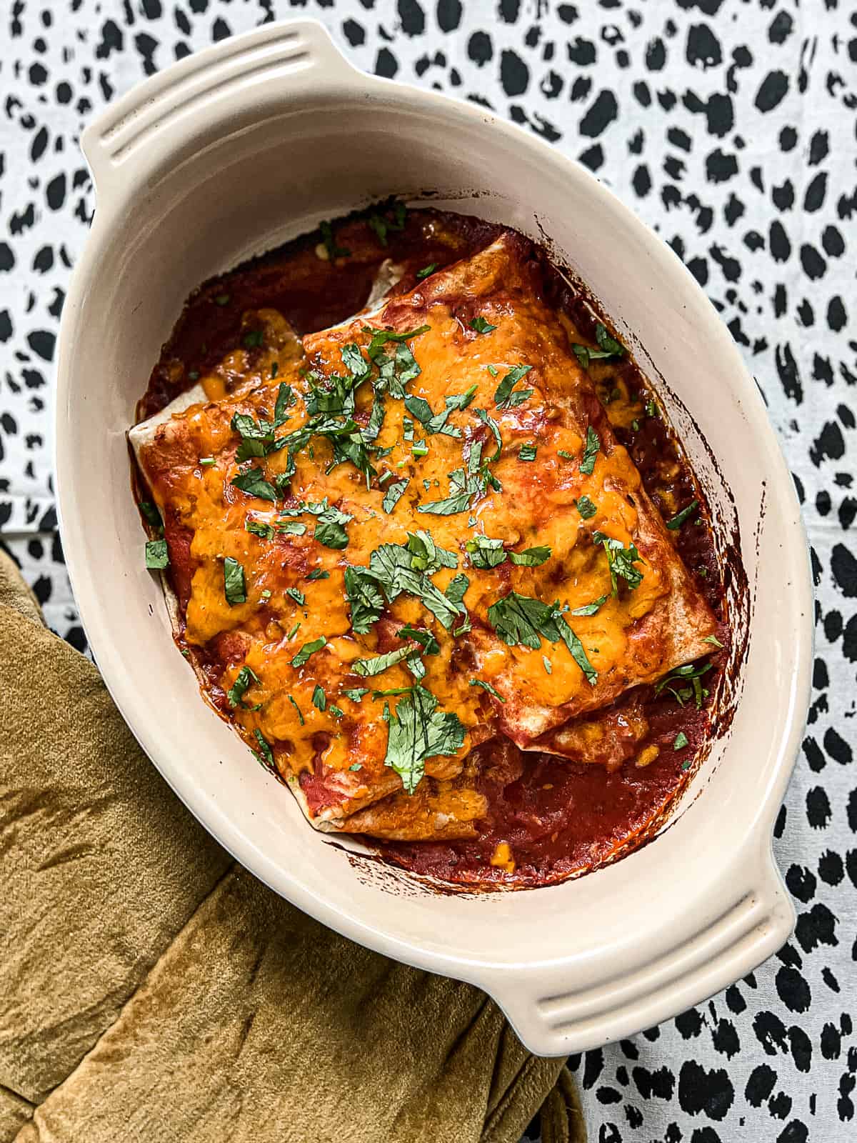 Oven Baked Chicken Enchiladas in a serving dish