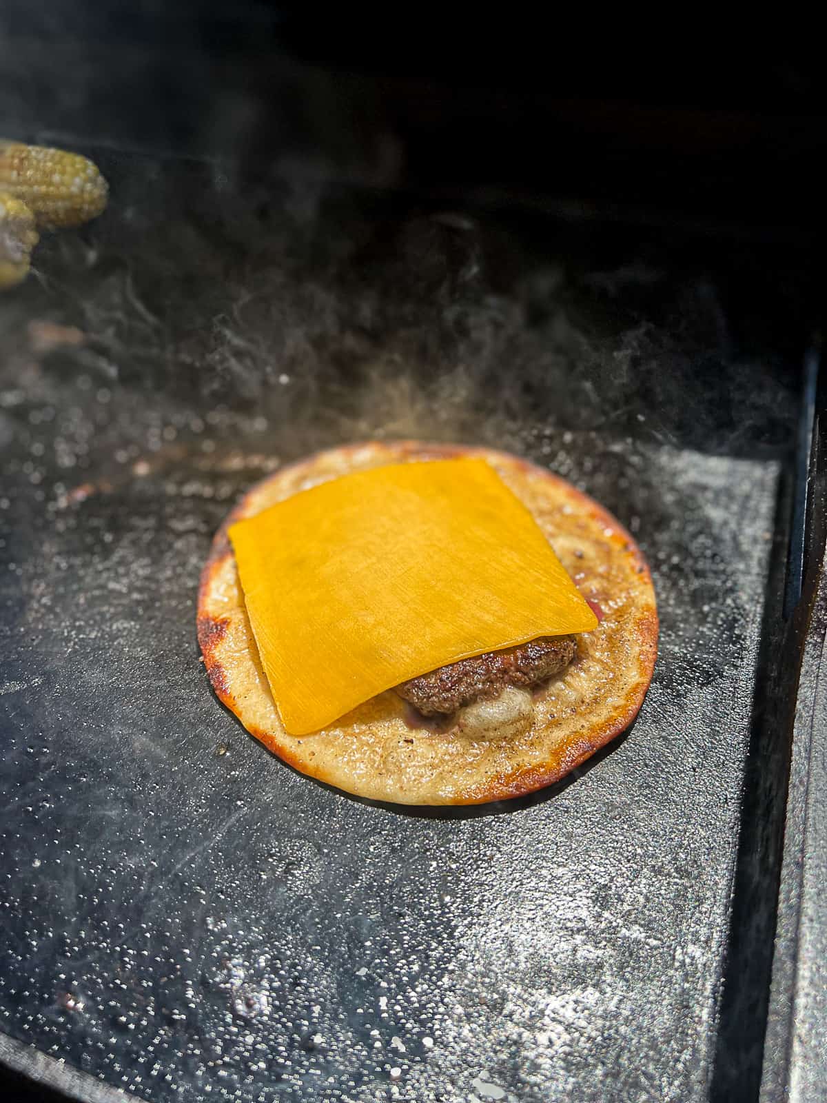 Cooking a Taco Smashed Burger with Cheese on the Griddle