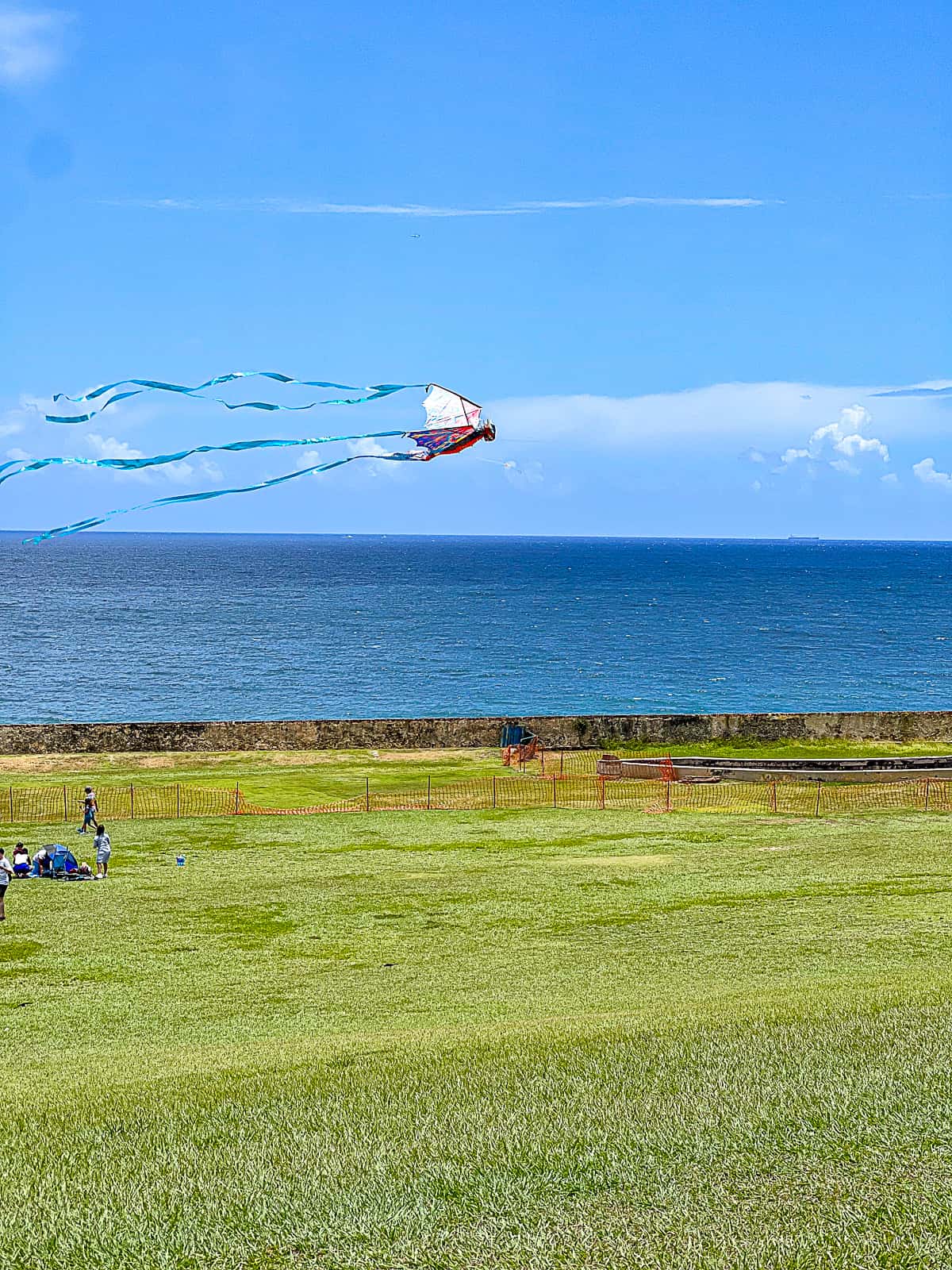 Flying Kites Outside San Felipe Del Morro Castle by San Juan Bay