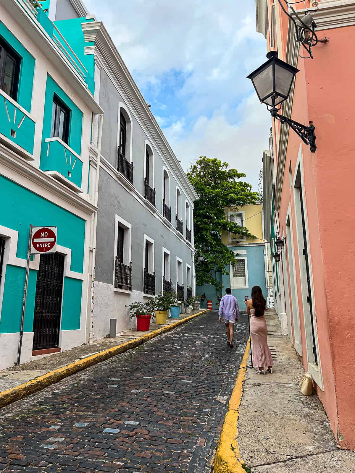 Tourists walking in streets of Old San Juan Sip Bite Go