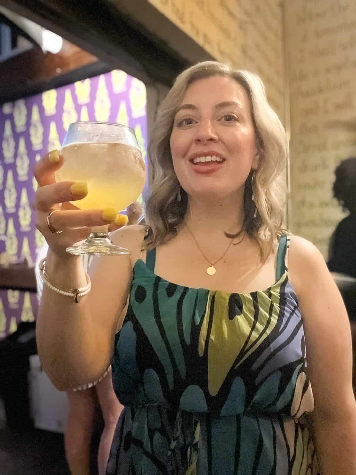 Travel Food Blogger in Puerto Rico Holding Craft Beer at La Taberna Lúpulo Restaurant