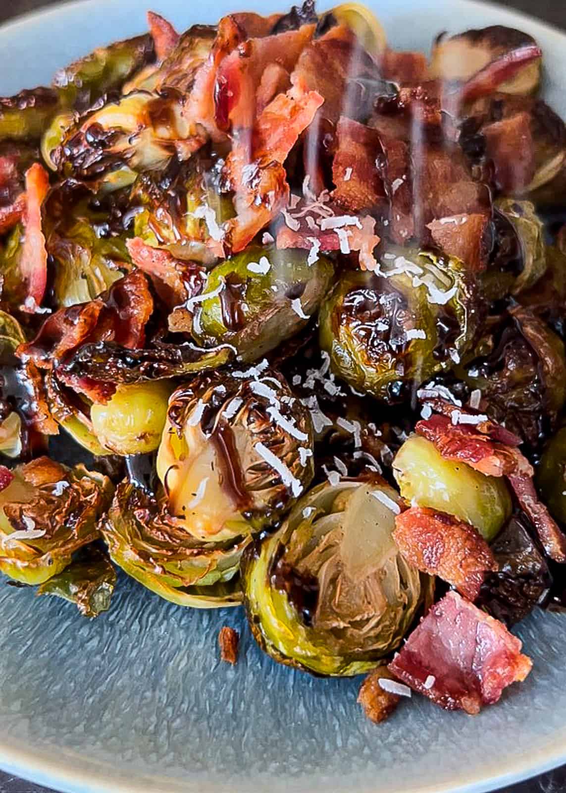 Closeup of Parmesan on Roasted Brussels Spouts with Bacon