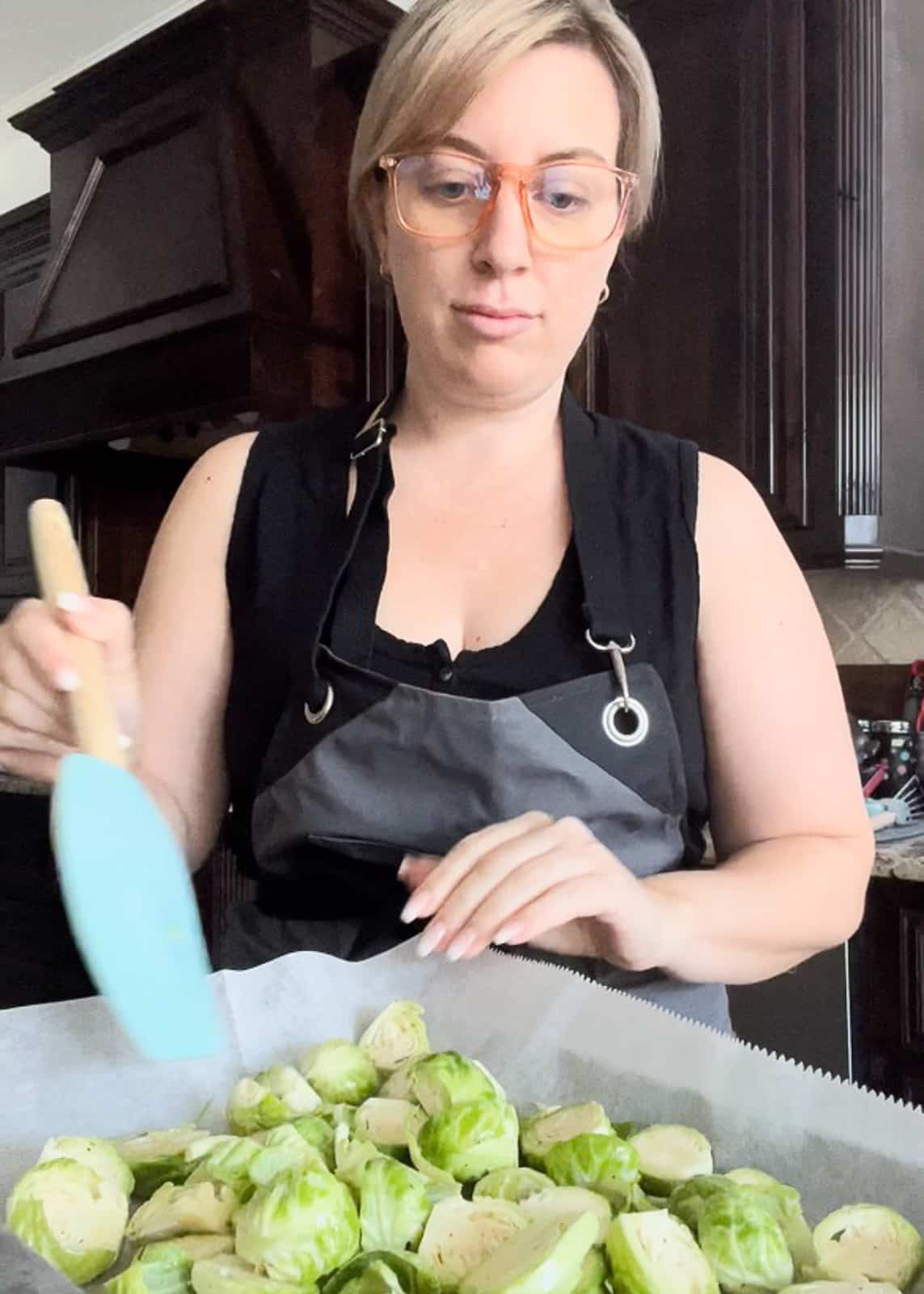 Jenna Passaro food blogger demonstrating How to cook oven roasted Brussels sprouts