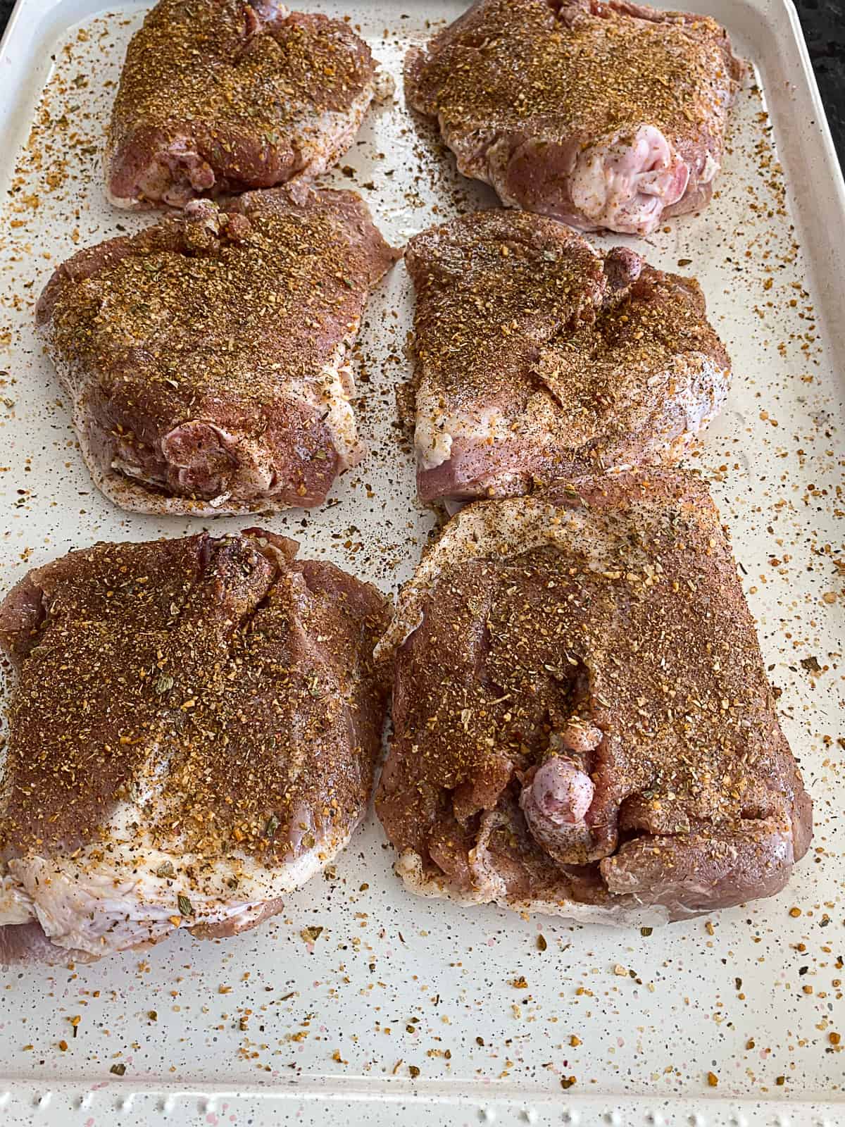 Seasoned Turkey Thighs on a sheet pan