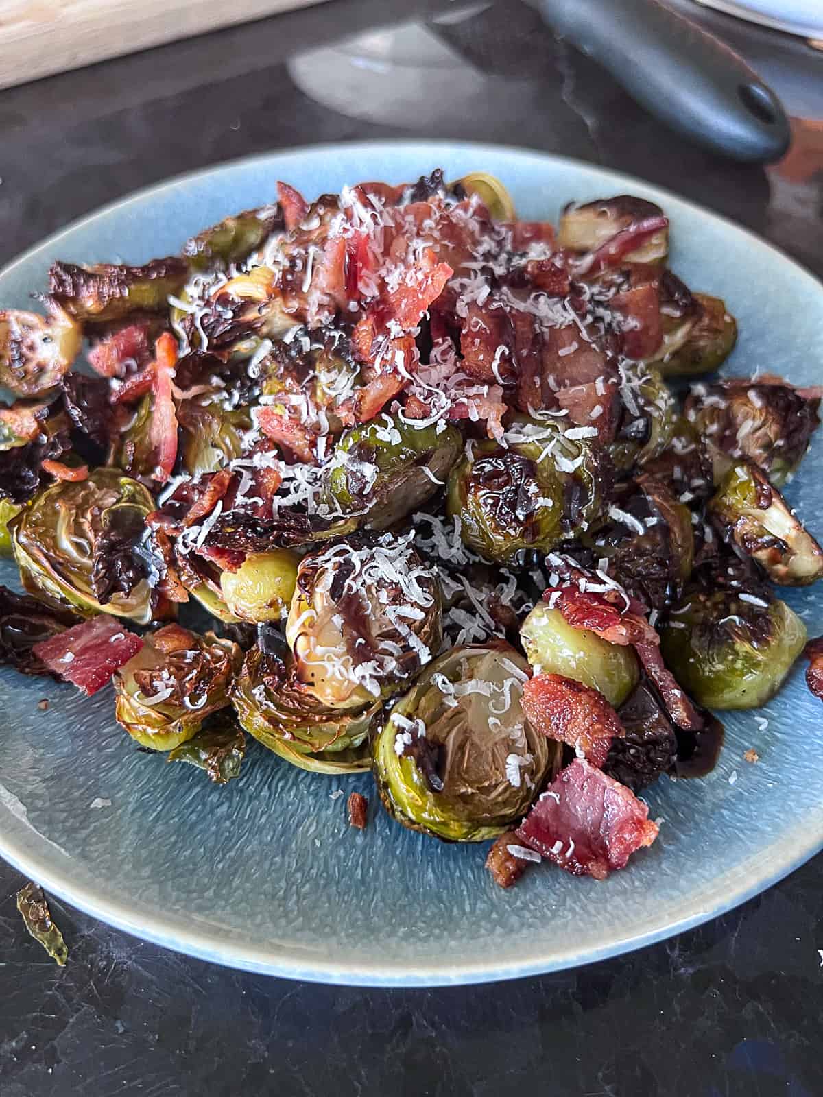 Side Dish with Roasted Brussels Spouts and Bacon with balsamic glaze and parmesan cheese