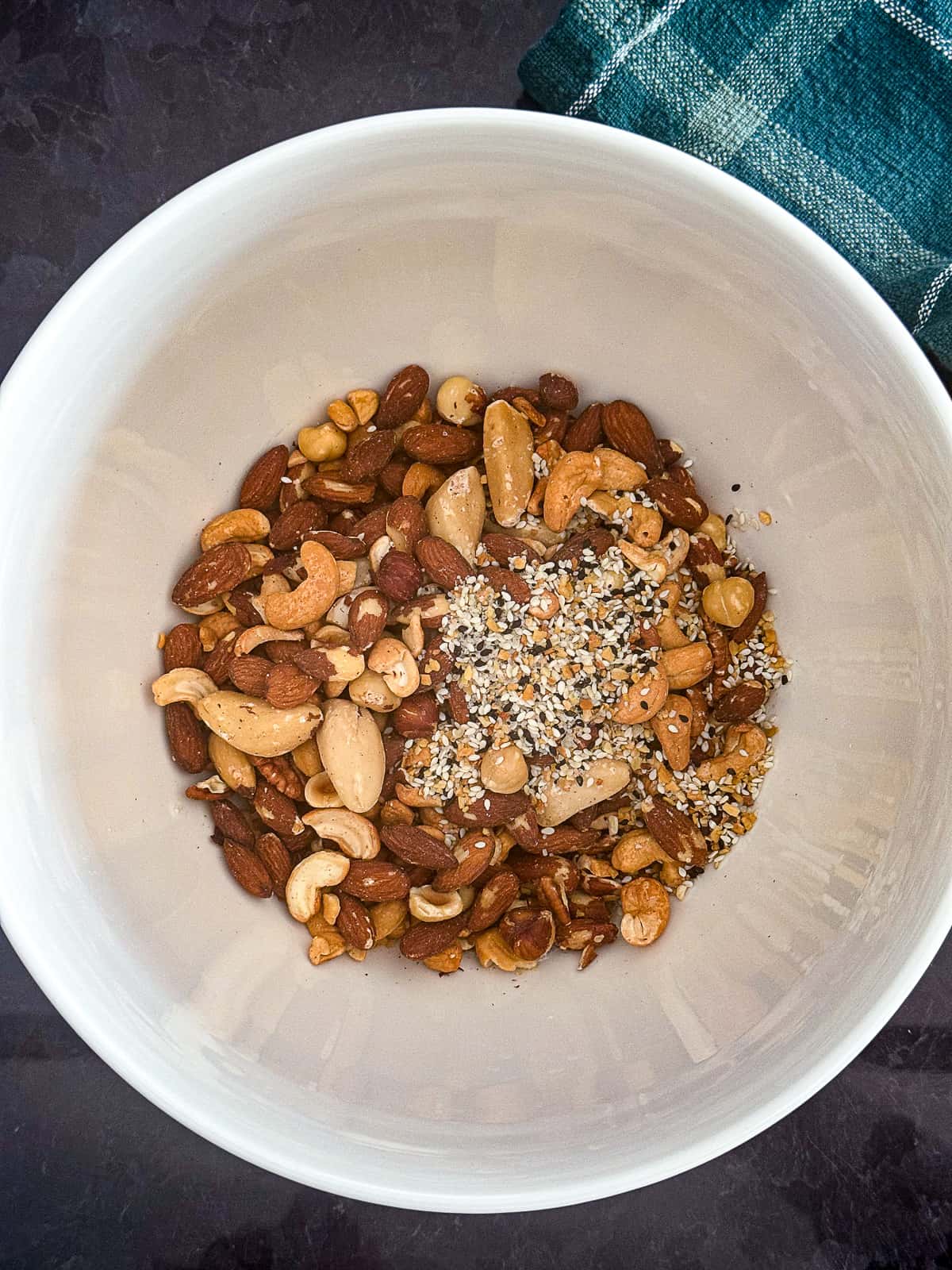 Mixing Bowl with Everything Bagel Spiced Nuts Ingredients 