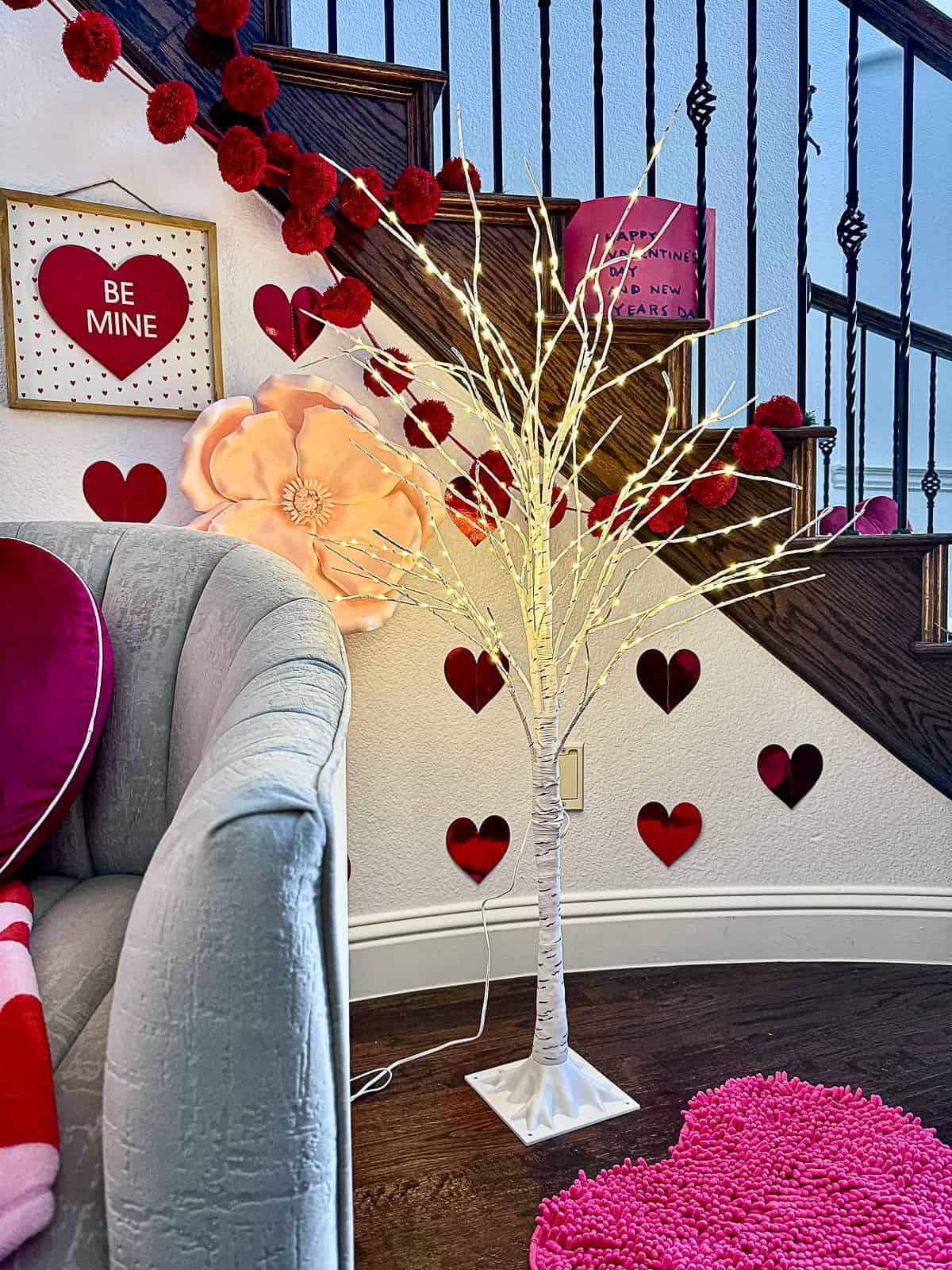 Light up birch tree with Valentine's Day Decor in a Foyer