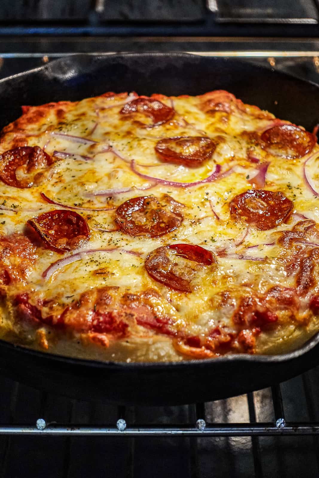Closeup of Baking Pizza in Cast Iron