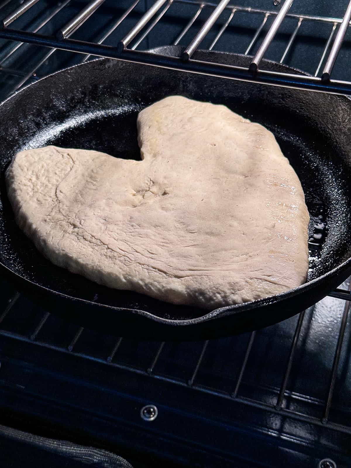 Par Baking Heart Shaped Pizza in the oven