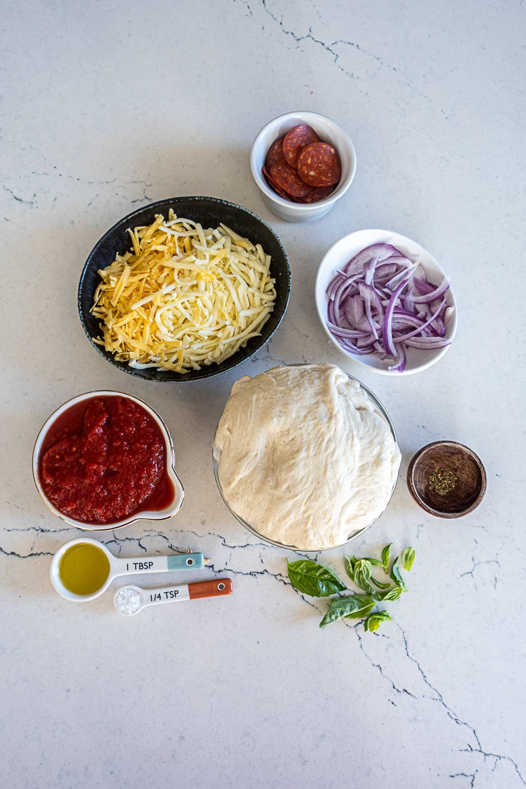 Prepped Ingredients for Cast Iron Pizza on a Counter