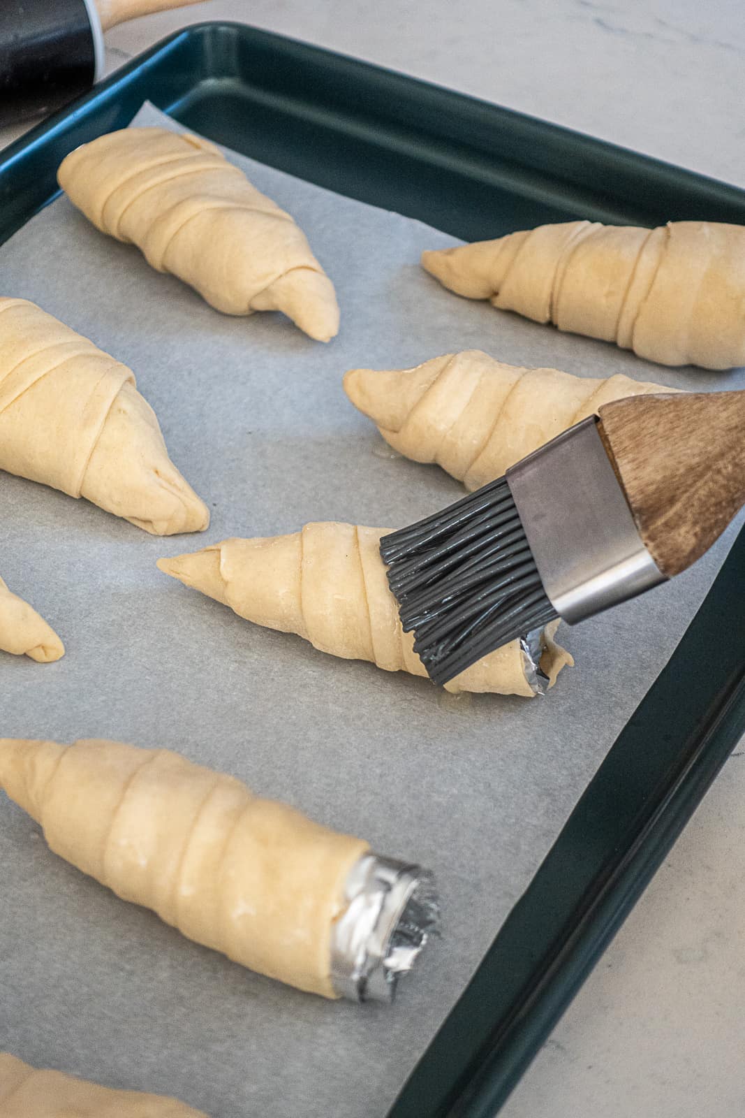 Brushing Easter Puff Pastry Carrots with Egg Wash
