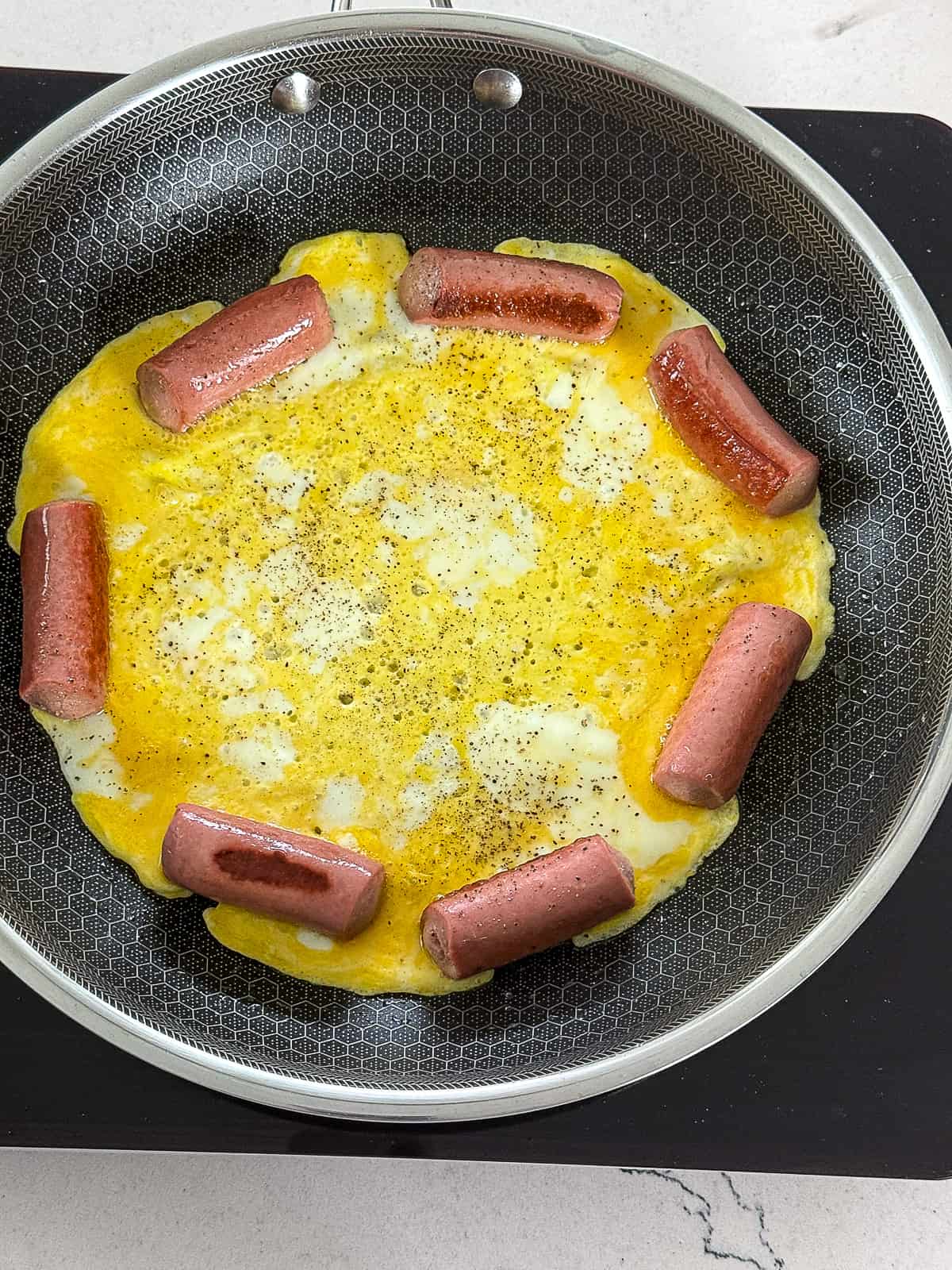 Cooking Little Wiener Hot Dogs and Eggs in hexclad pan