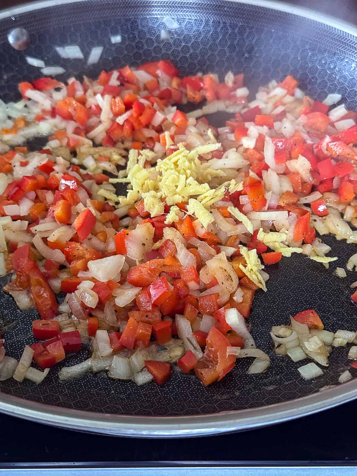 Cooking vegetables for Turmeric Chicken Dish