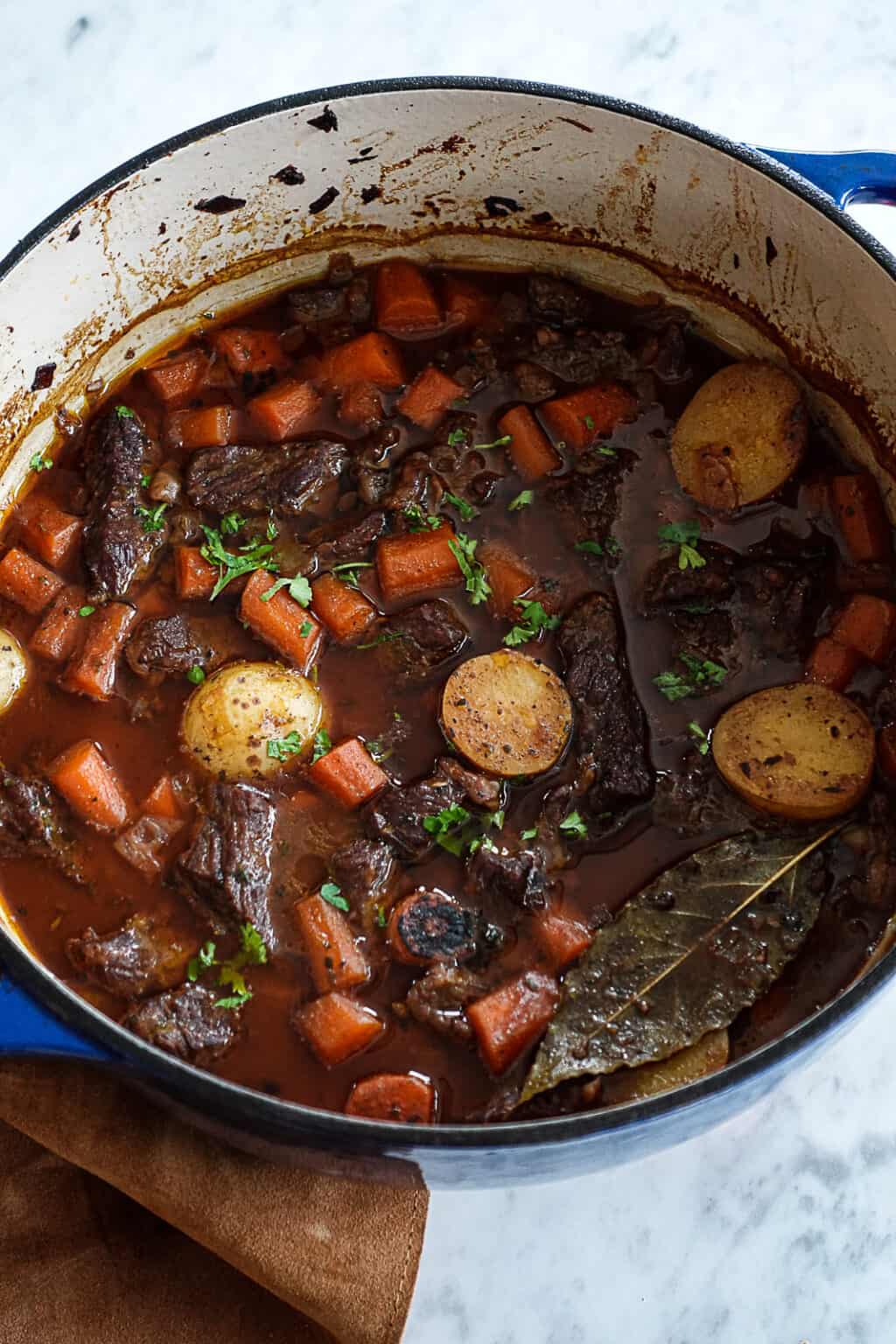 Hearty Dutch Oven Beef Stew Recipe - Sip Bite Go