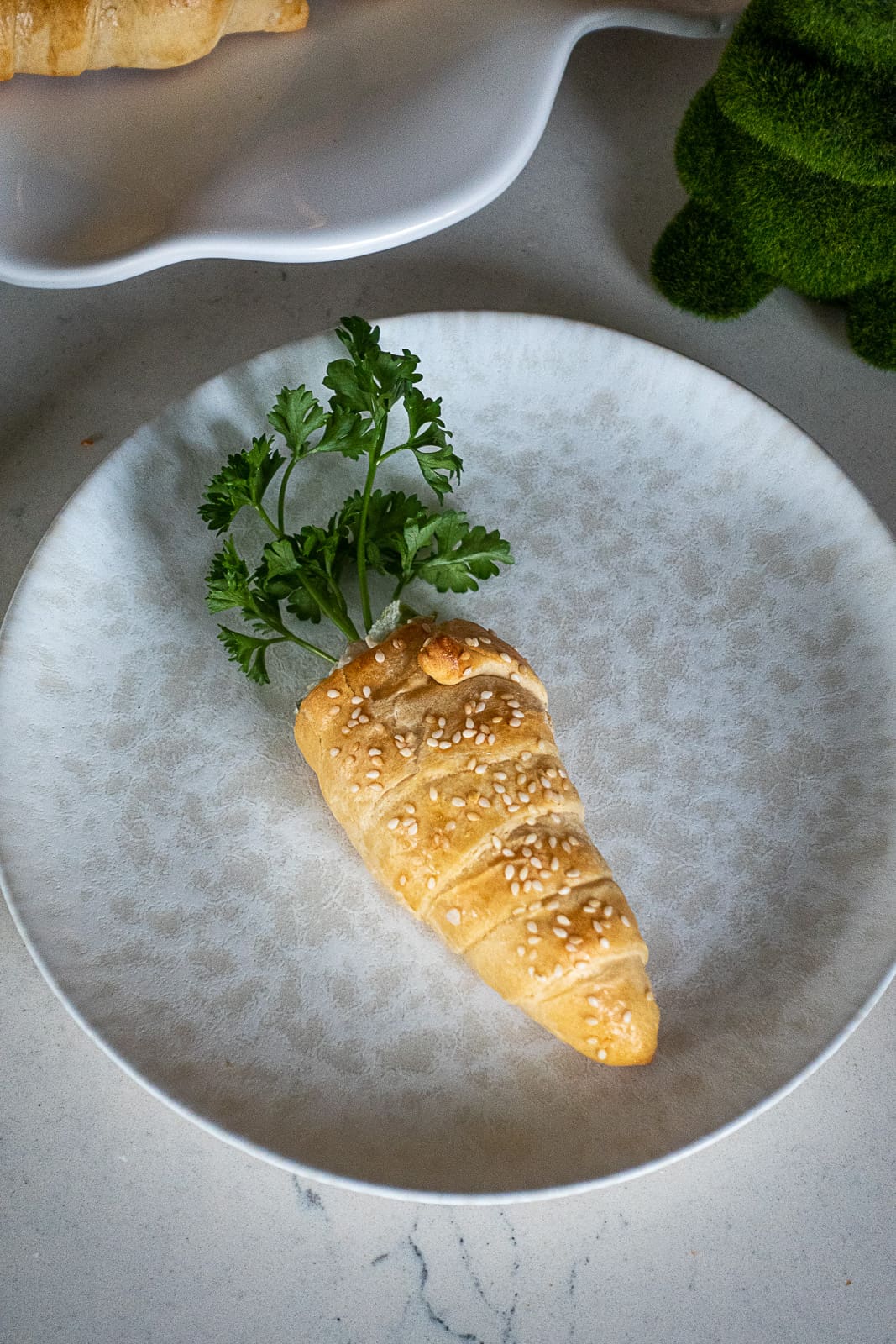 Easter Puff Pastry Carrot on an appetizer plate