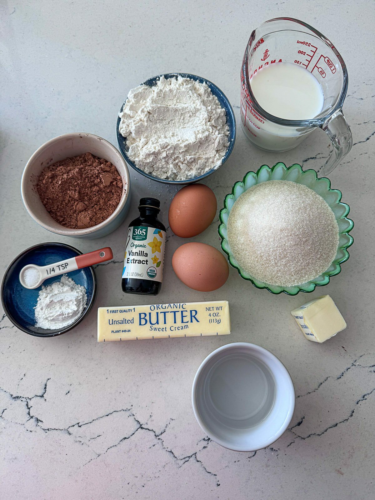 Ingredients to make Chocolate Loaf Cake Prepped on a counter