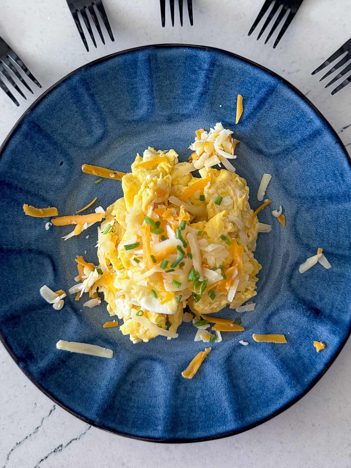 Scrambled Eggs made with Milk on a breakfast plate