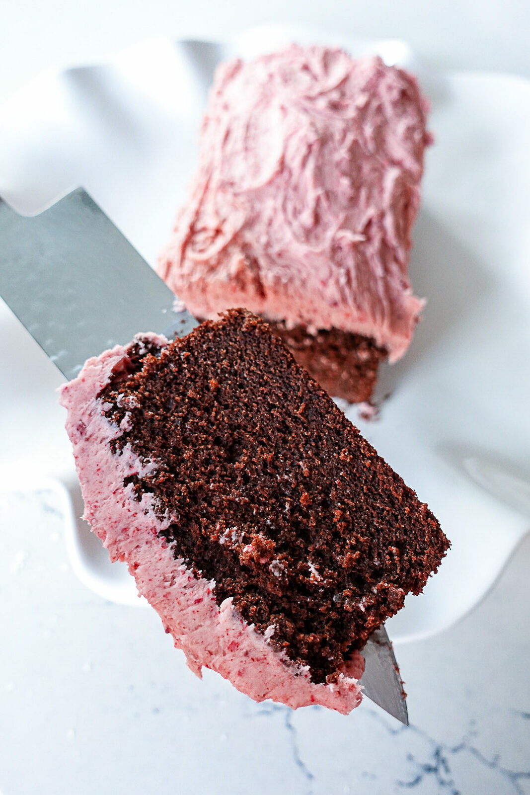 Slice of Chocolate Loaf Cake with Strawberry Frosting