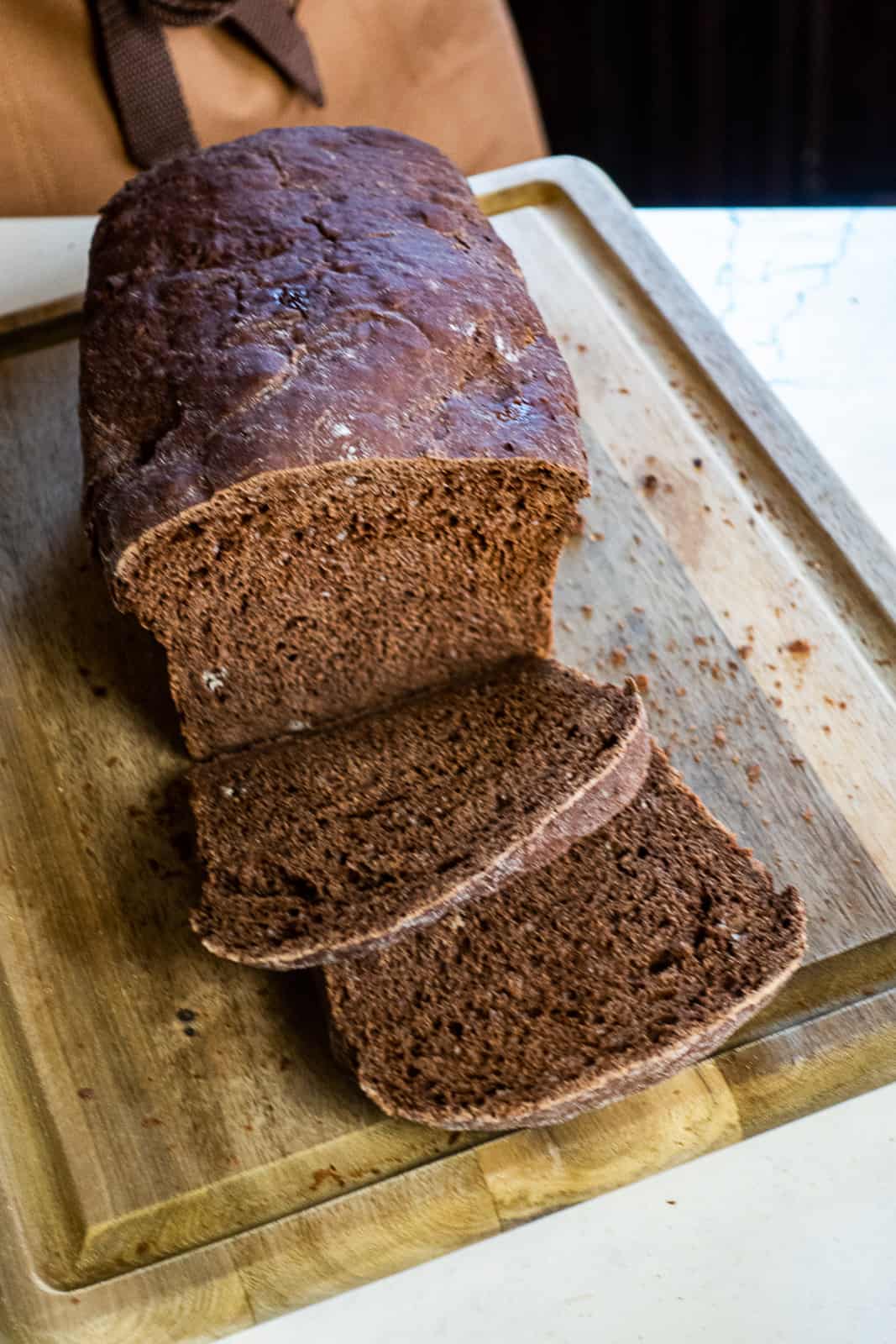Sliced Chocolate Yeast Bread Loaf on a cutting board
