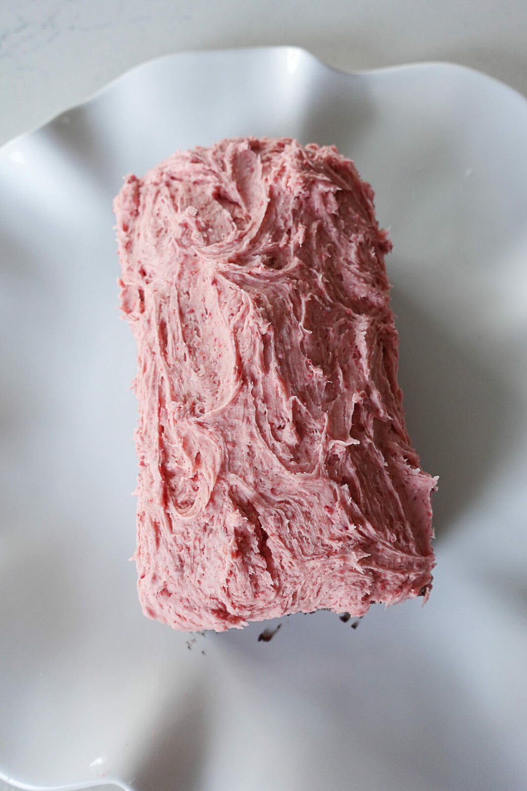 Strawberry Frosting on top of Chocolate Loaf Cake