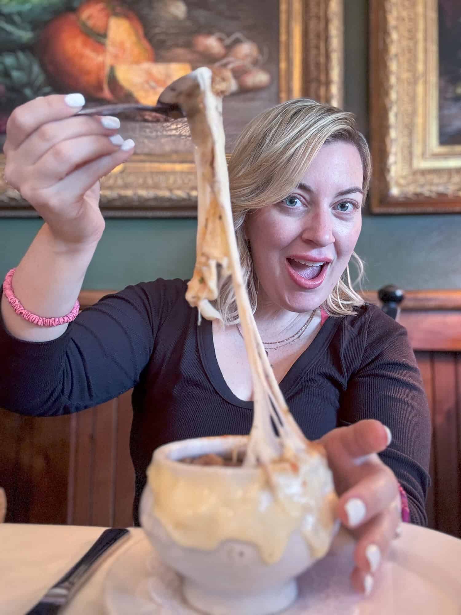 Jenna Passaro food and travel blogger in Utah eating Food from Blue Boar Inn and Restaurant