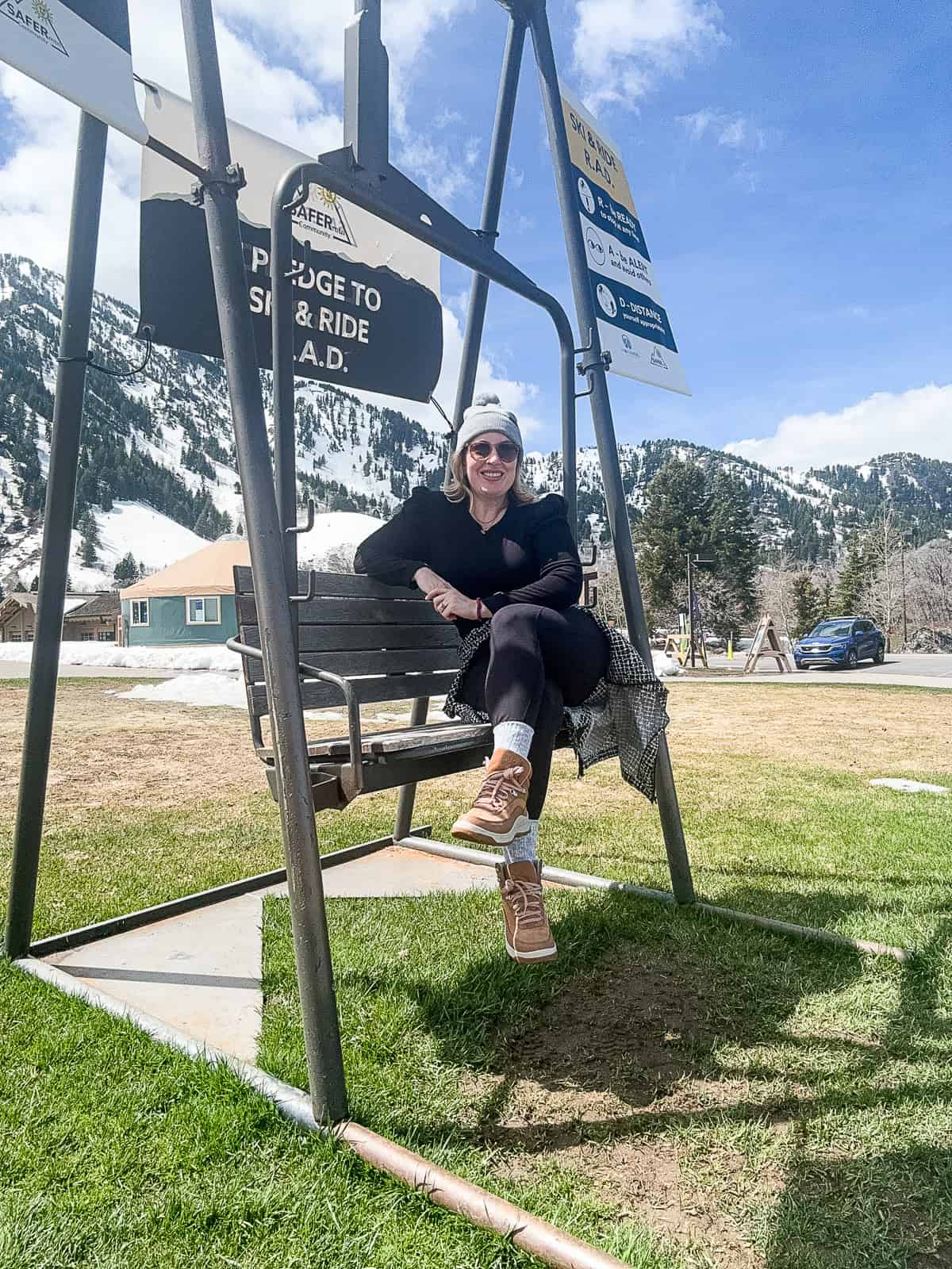 Jenna Passaro travel blogger outside Snowbasin Ski Resort in Ogden Utah in April