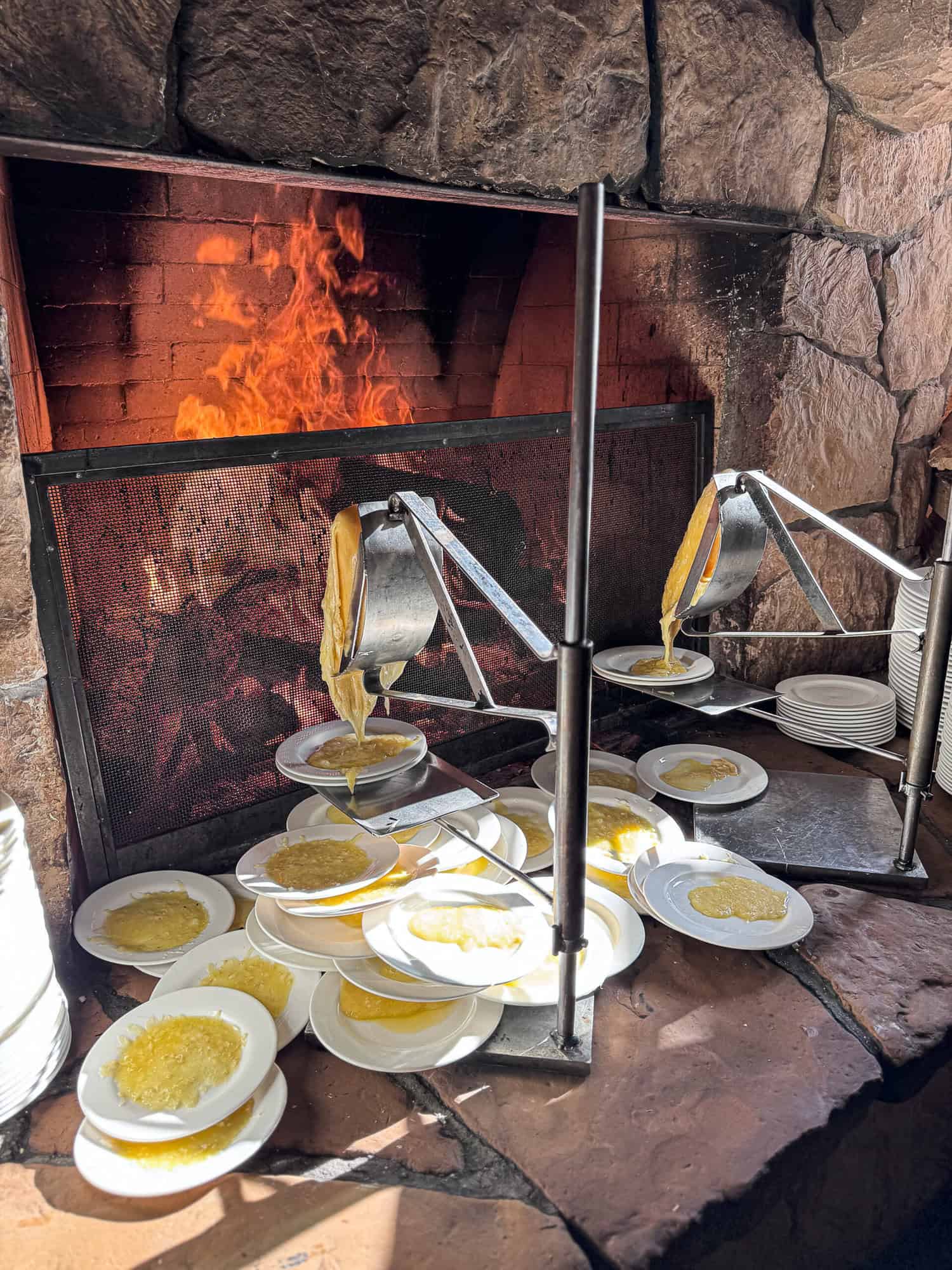 Racklet cheese melting by a fire at Deer Valley Resort