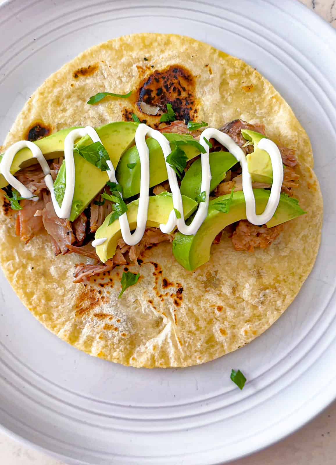 Slow Cooked Pineapple Pork Tacos with avocado