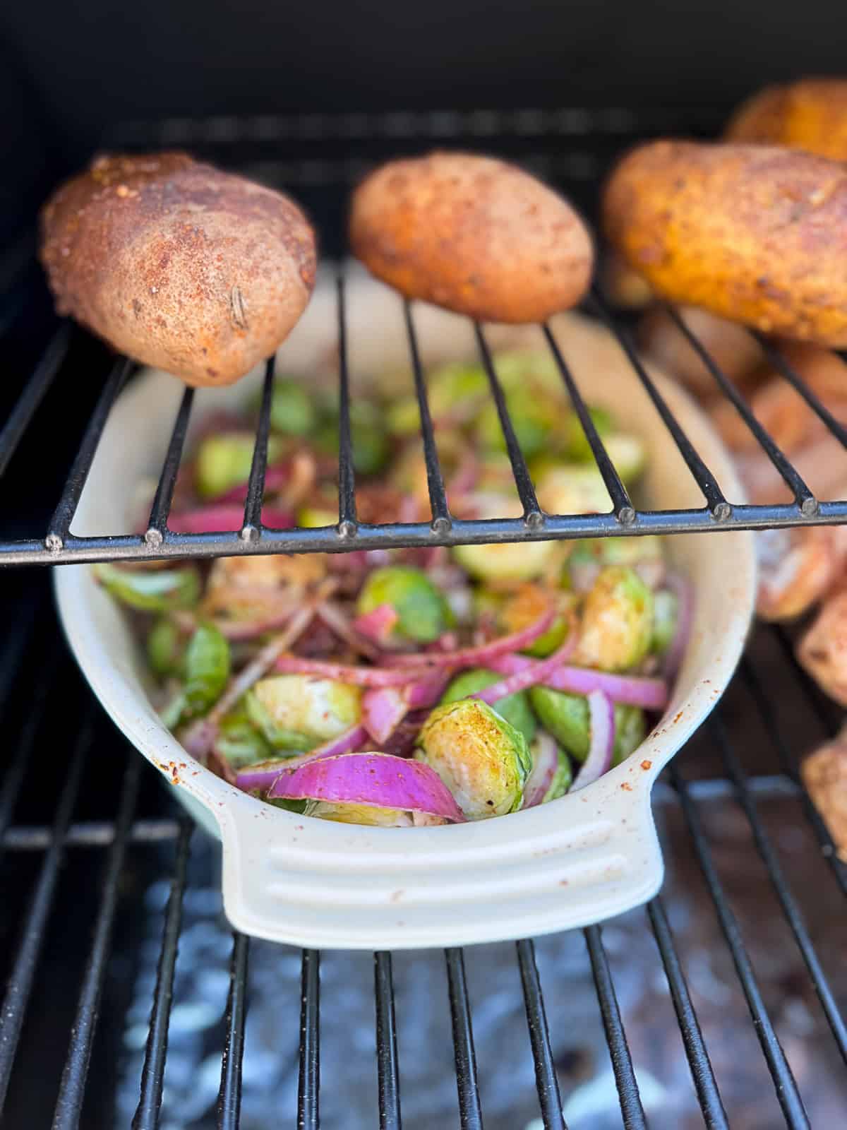 Baked Potatoes and Brussels Sprouts Smoking with Traeger Maple Pellets