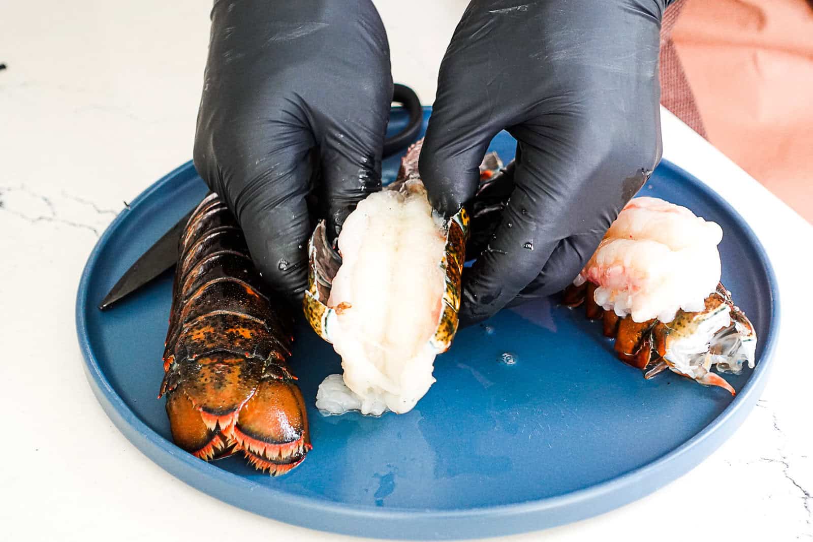Removing meat from lobster tail before grilling