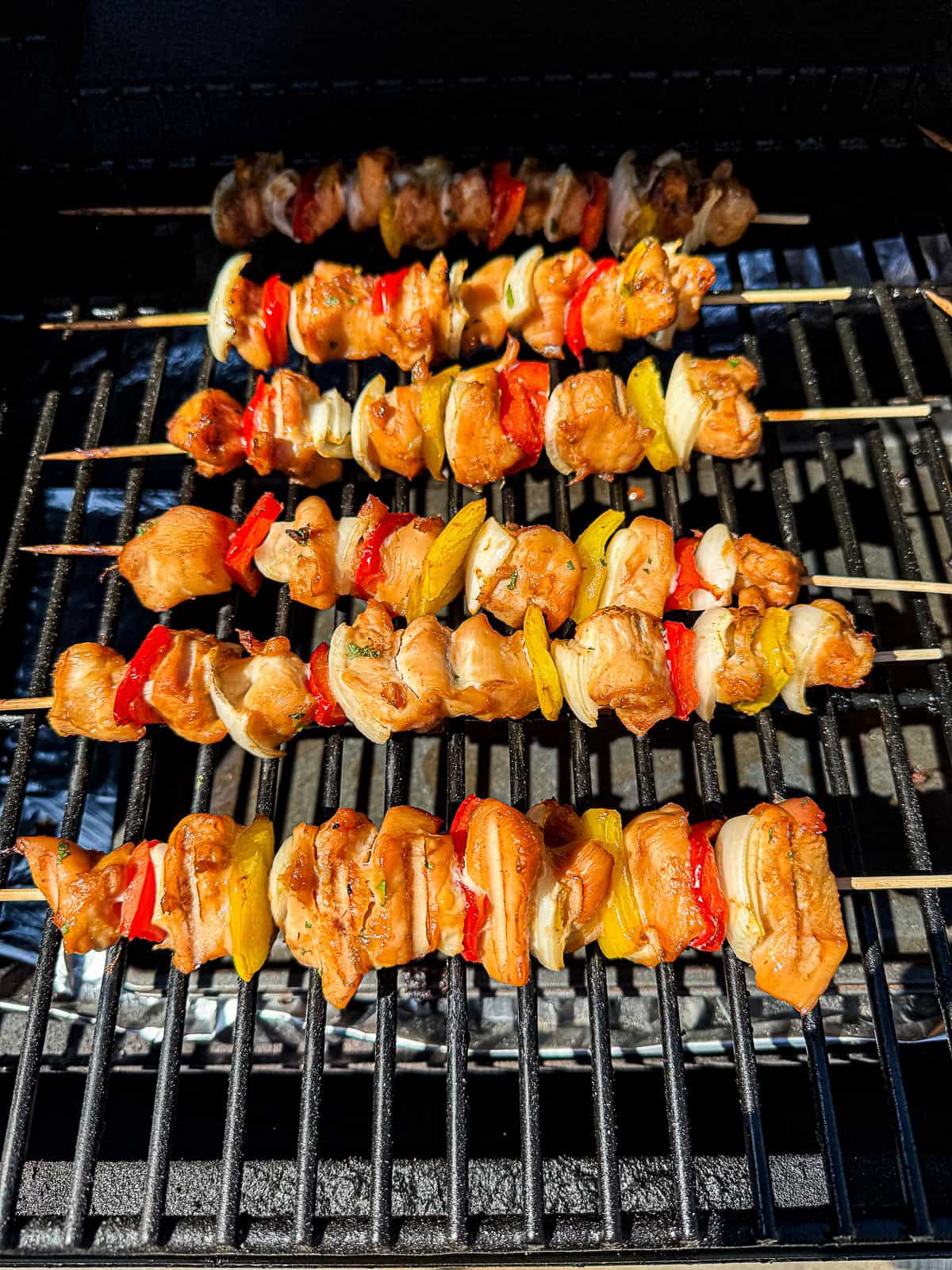 BBQ Smoking Marinated Chicken Breast on Skewers in the Traeger Grill 