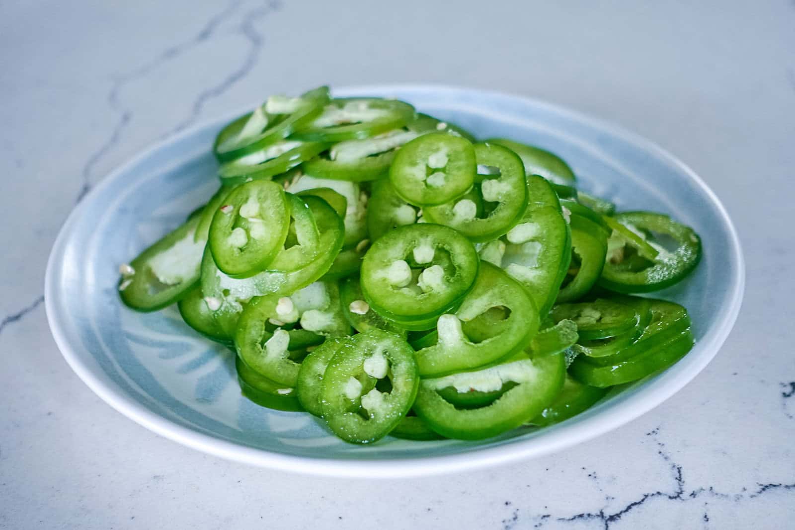 Plate of thinly slice jalapenos