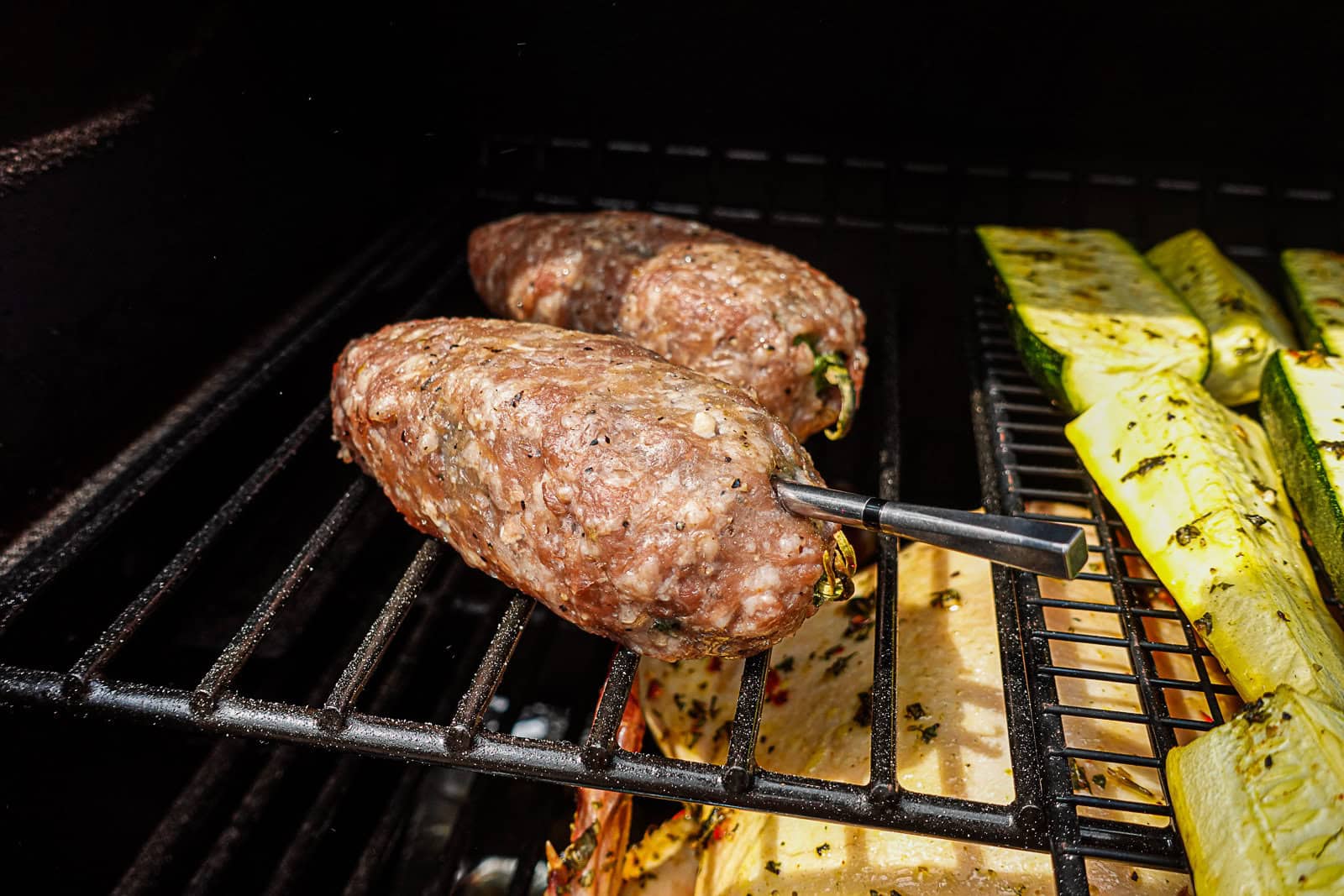 Smoking Texas Torpedoes with ground pork outside on Traeger Pellet Grill
