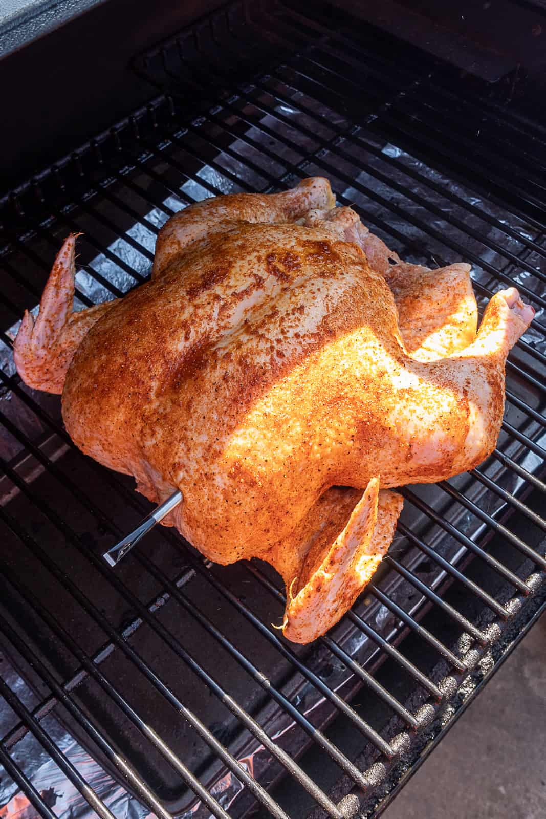 BBQ seasoned whole chicken on Traeger