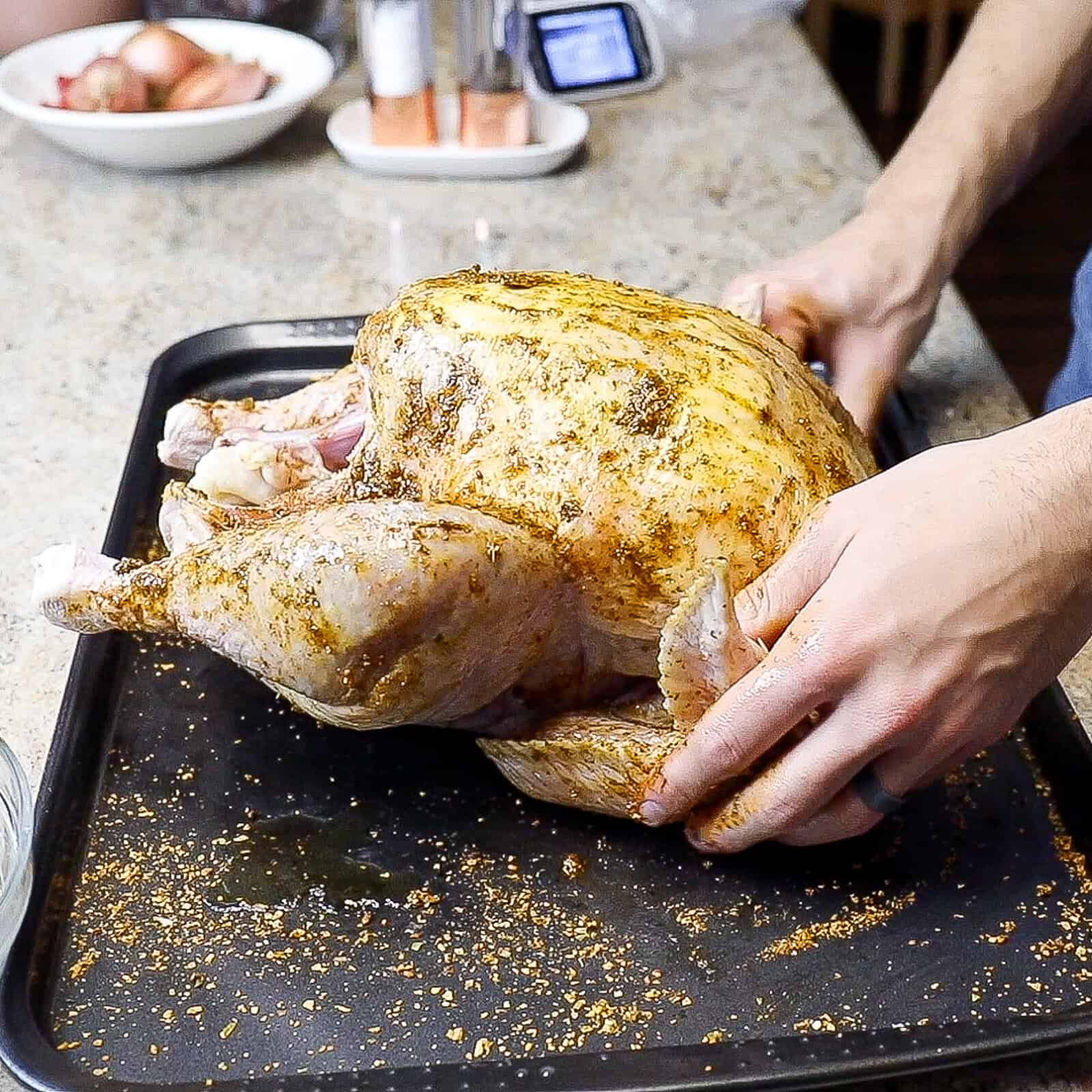 Seasoning a whole turkey with butter rub, poultry rub, and olive oil
