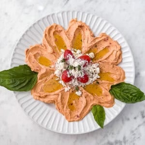 Flower Hummus Platter with feta tomatoes and herbs